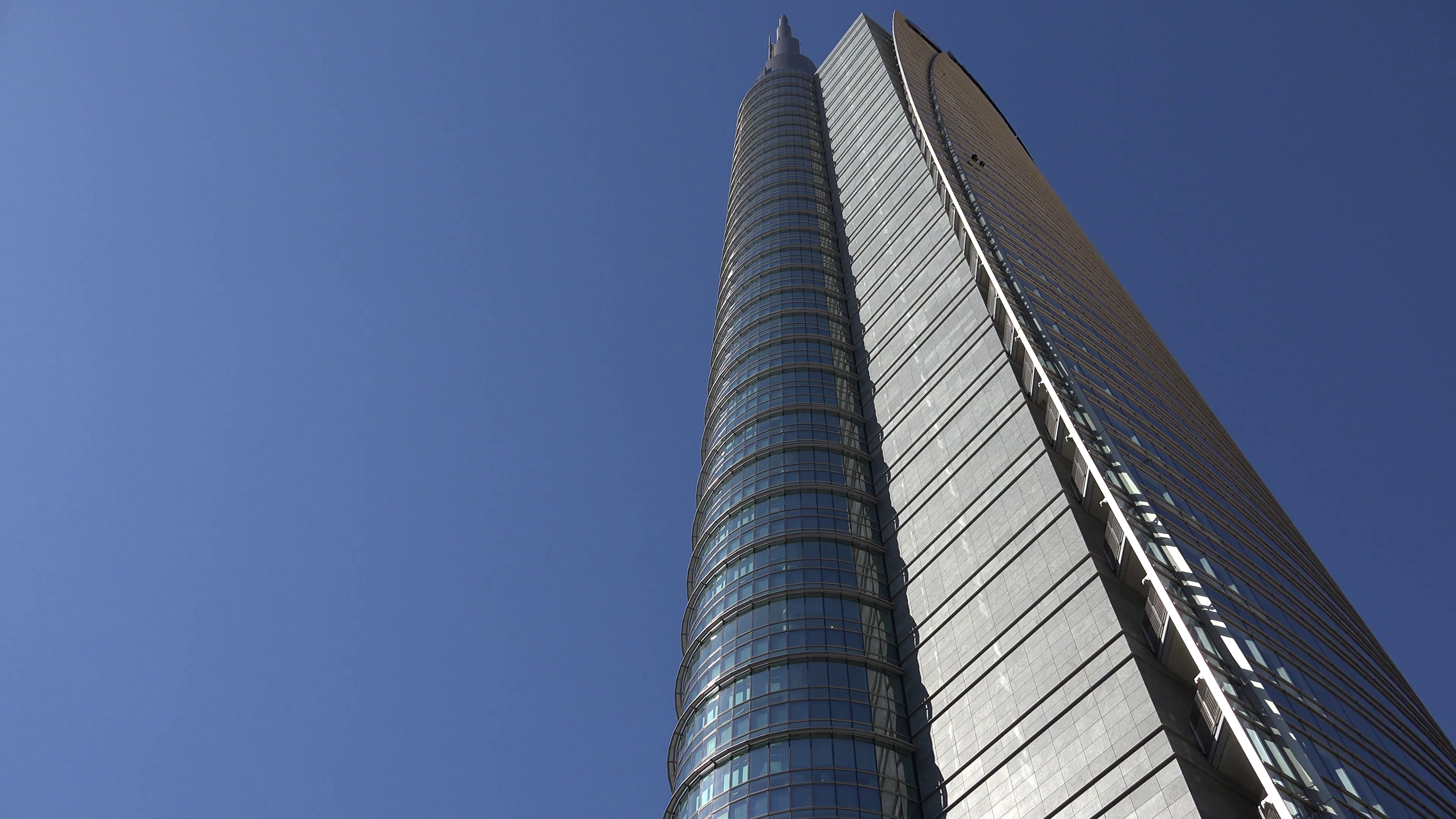 4K Modern tall tower glass facade blue sky skyscraper office ...