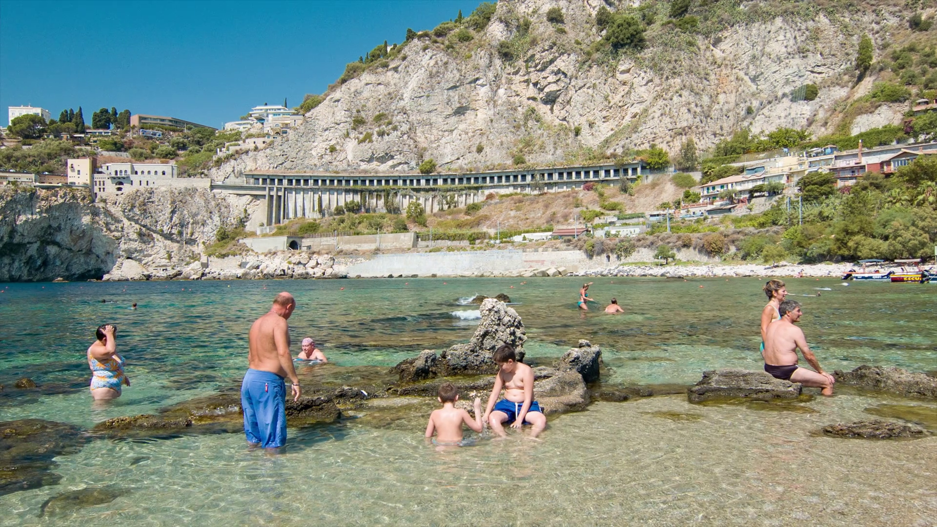 Taormina Sicily Italy Family Swimming at Isola Bella Beach during a ...