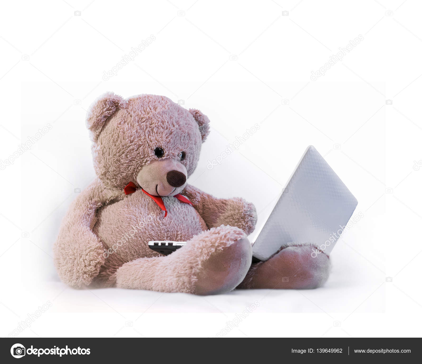 Teddy bear sitting and looking at notebook — Stock Photo © muraniya ...