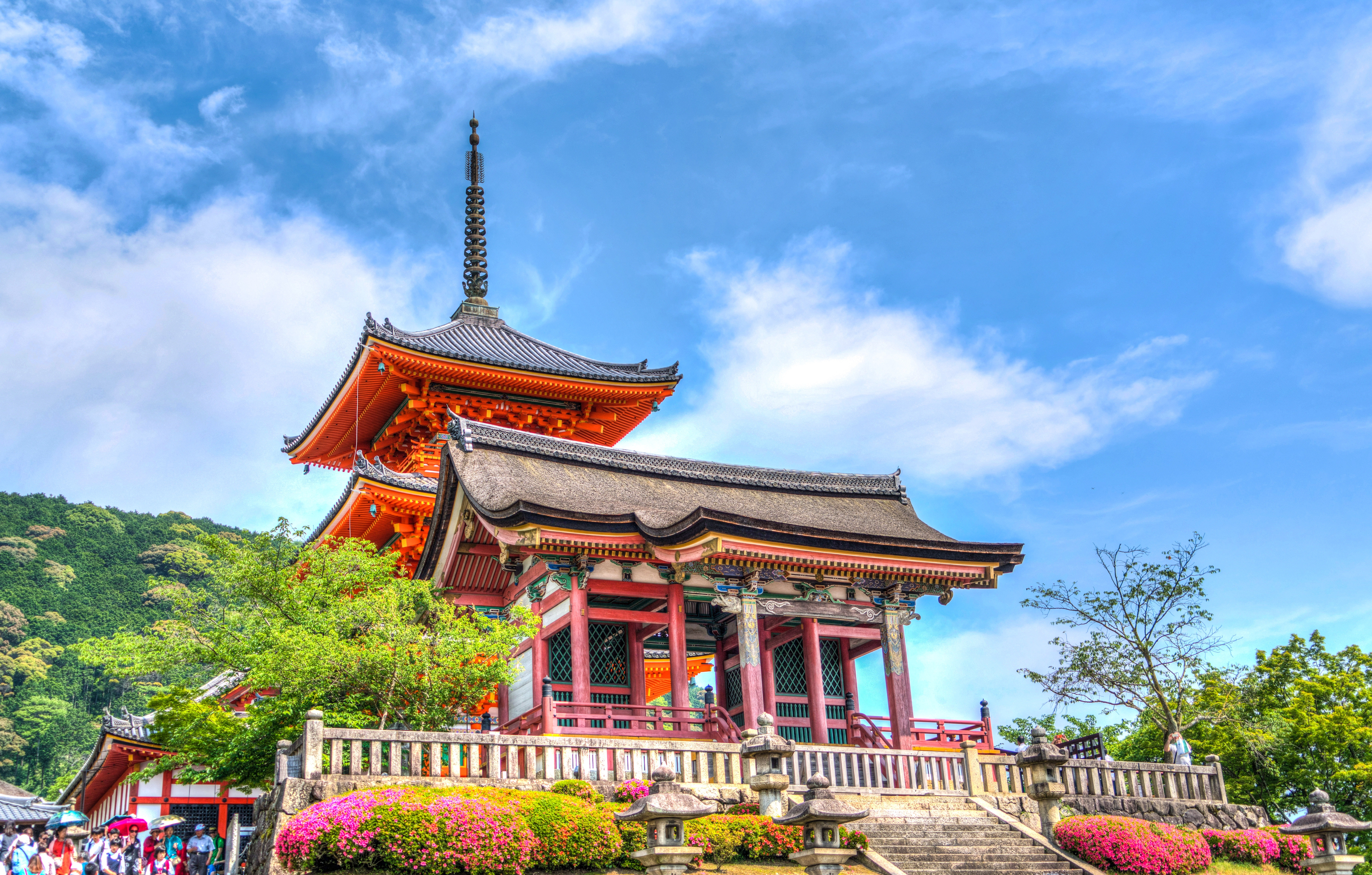 Temple on elevated area under blue sky and white clouds during daytime photo