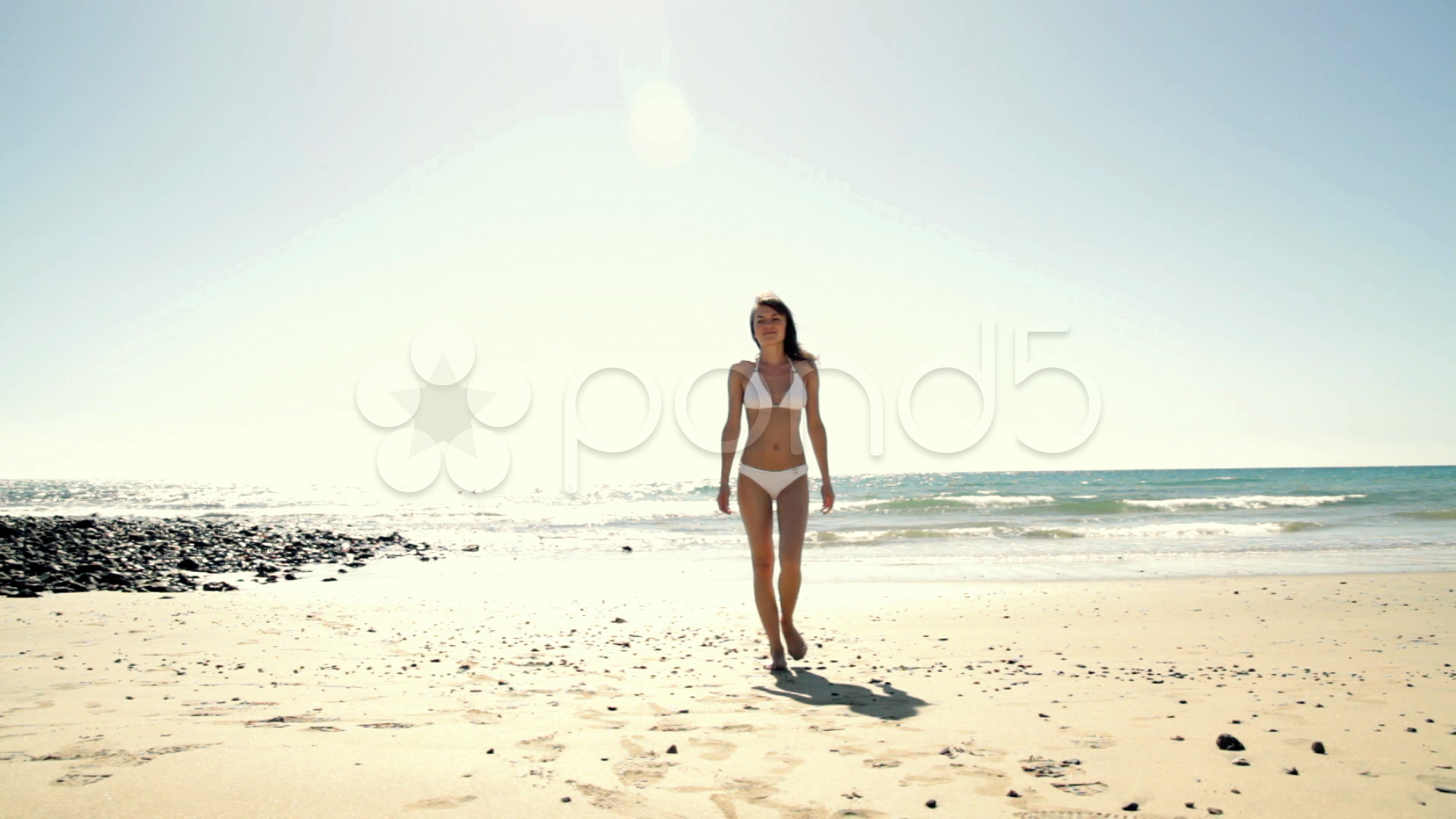 Video: Sexy woman in white bikini walking out of the sea ~ #1084324