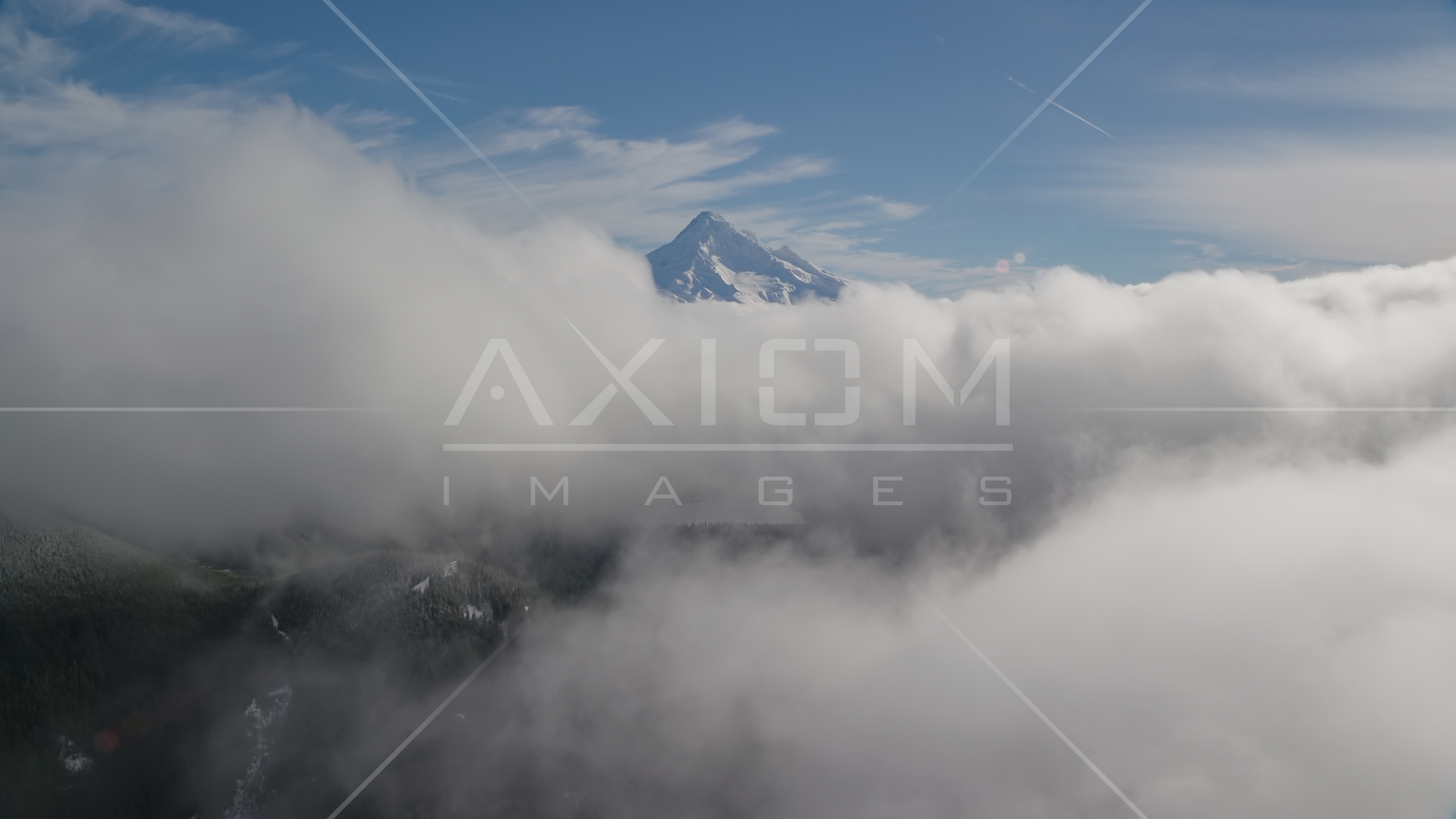 Mount Hood, visible above a layer of thick clouds, Cascade Range ...