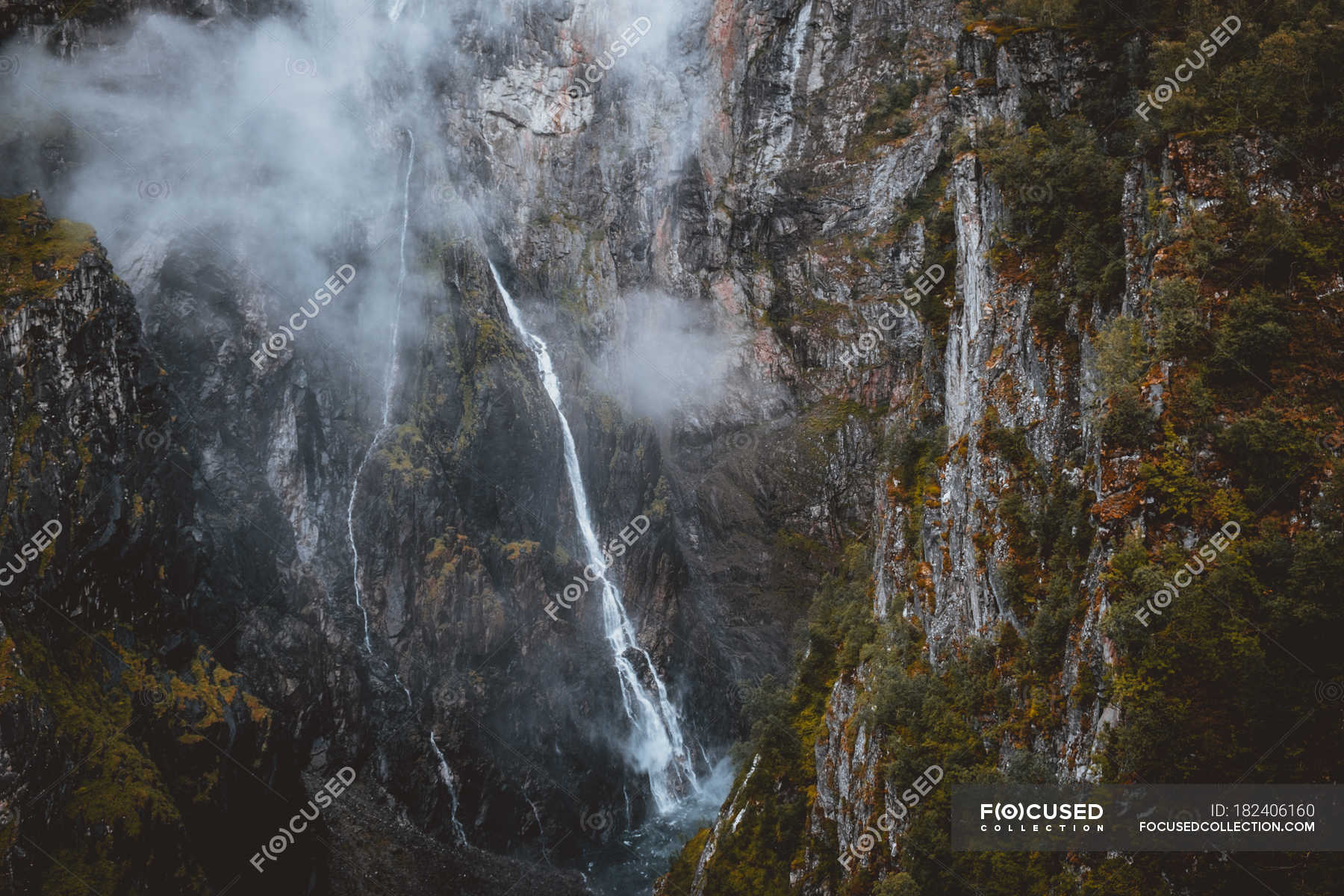 Aerial view of thin waterfall in mountain forest — Stock Photo ...