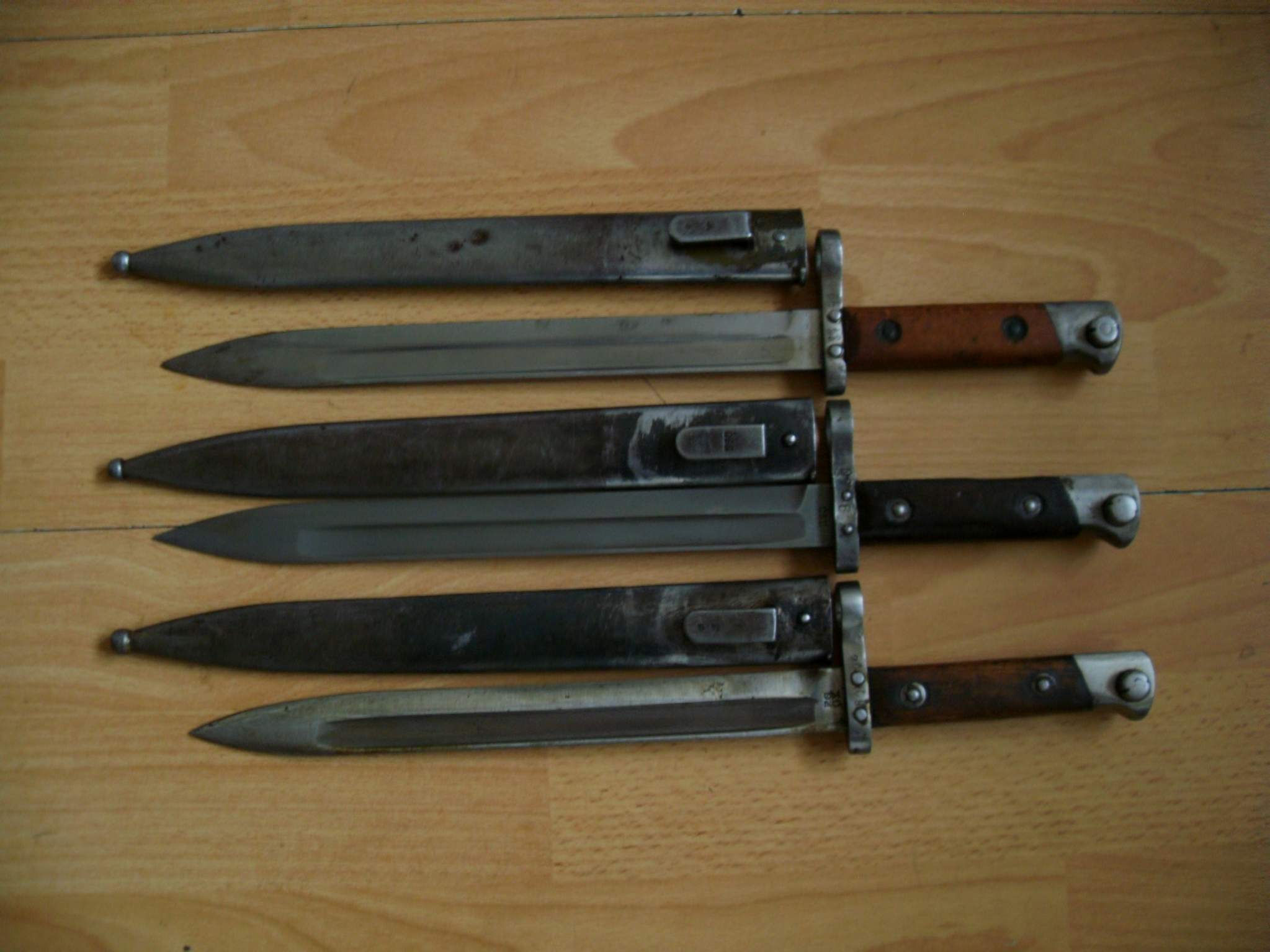 Three 1895 bayonets