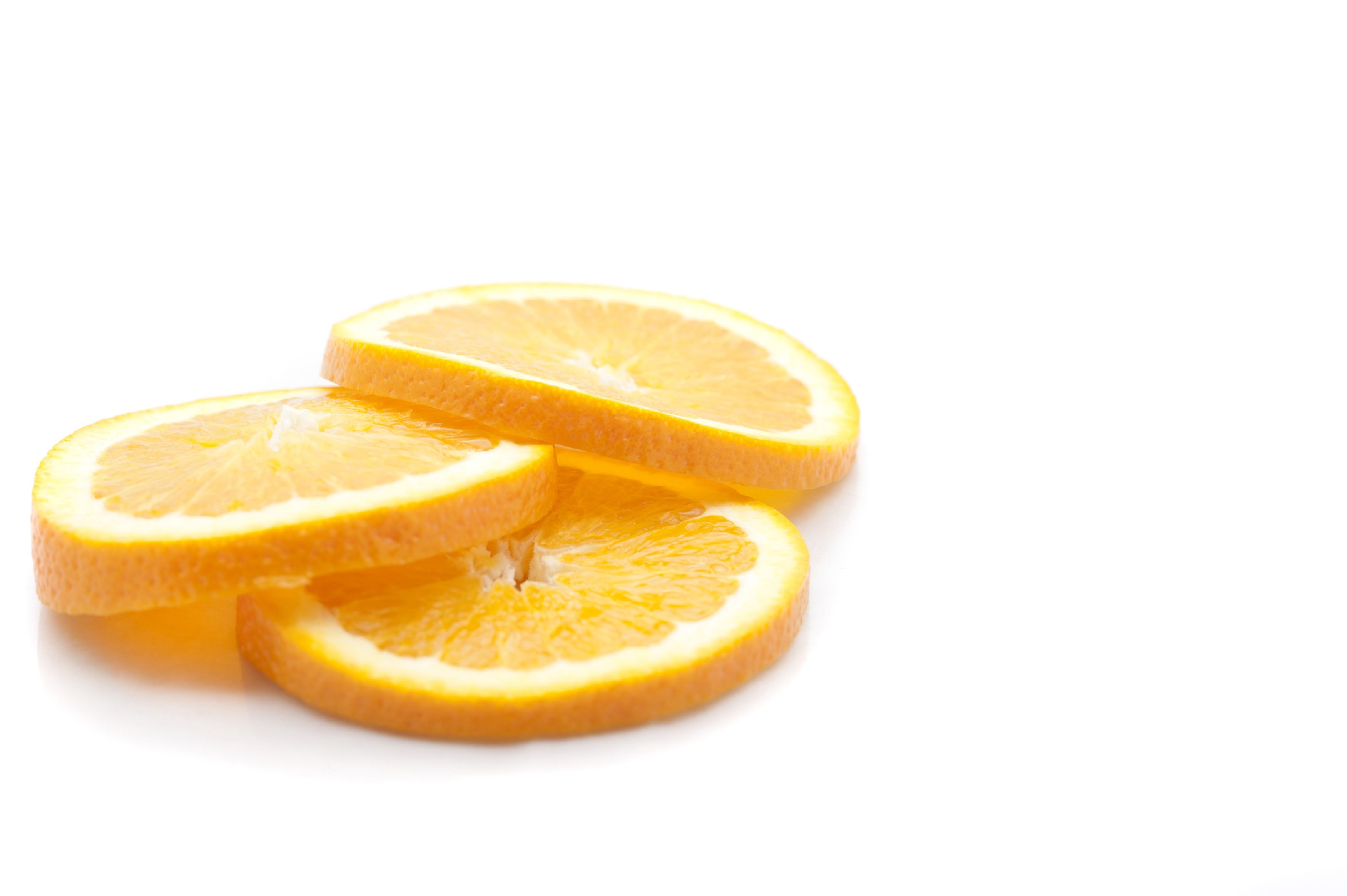 Three slices of fresh yellow juicy lemons - Free Stock Image
