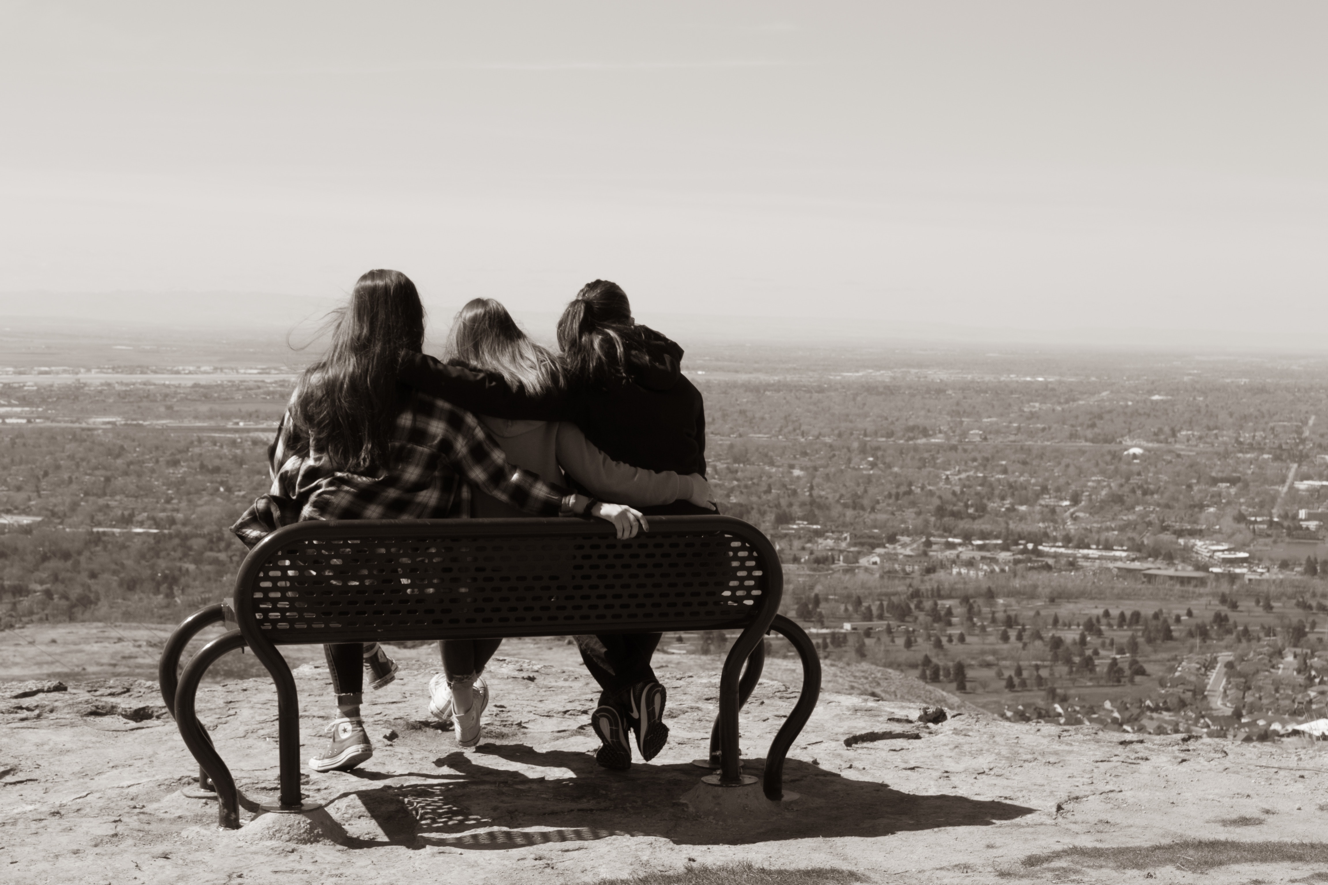Three girls having fun on the bench in the mountains, Three girls having fun on the bench in the mountains