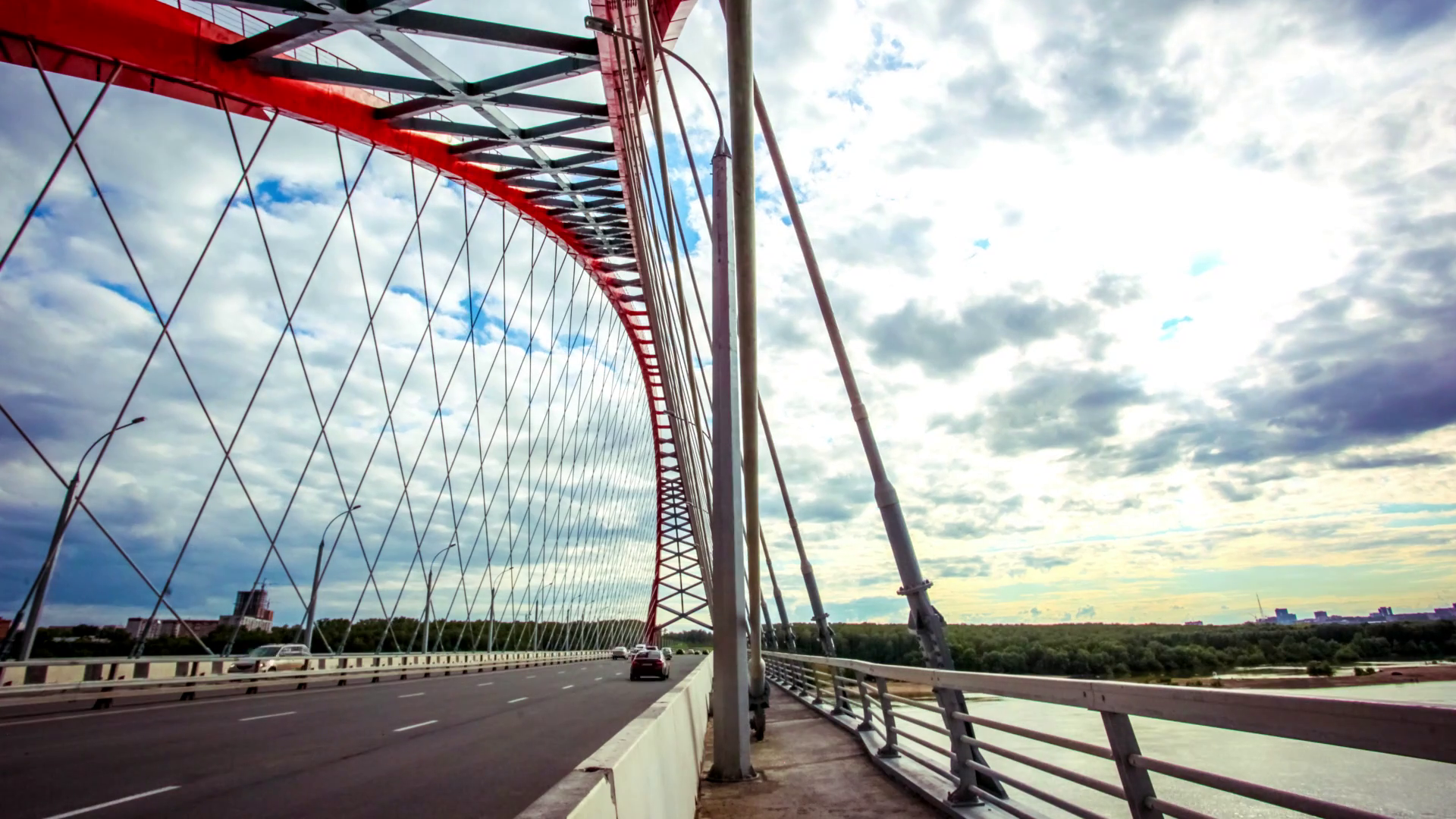 Time lapse of road through the bridge with blue sky background with ...