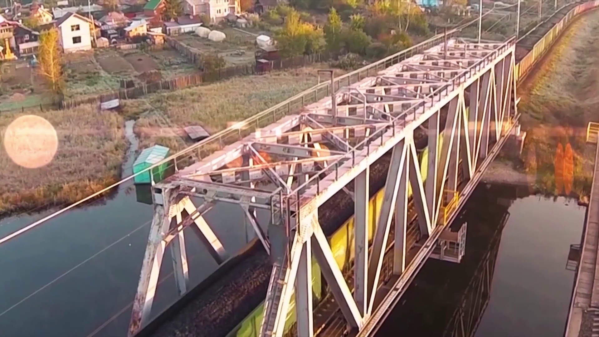 Aerial view on freight train goes through the bridge. train or ...
