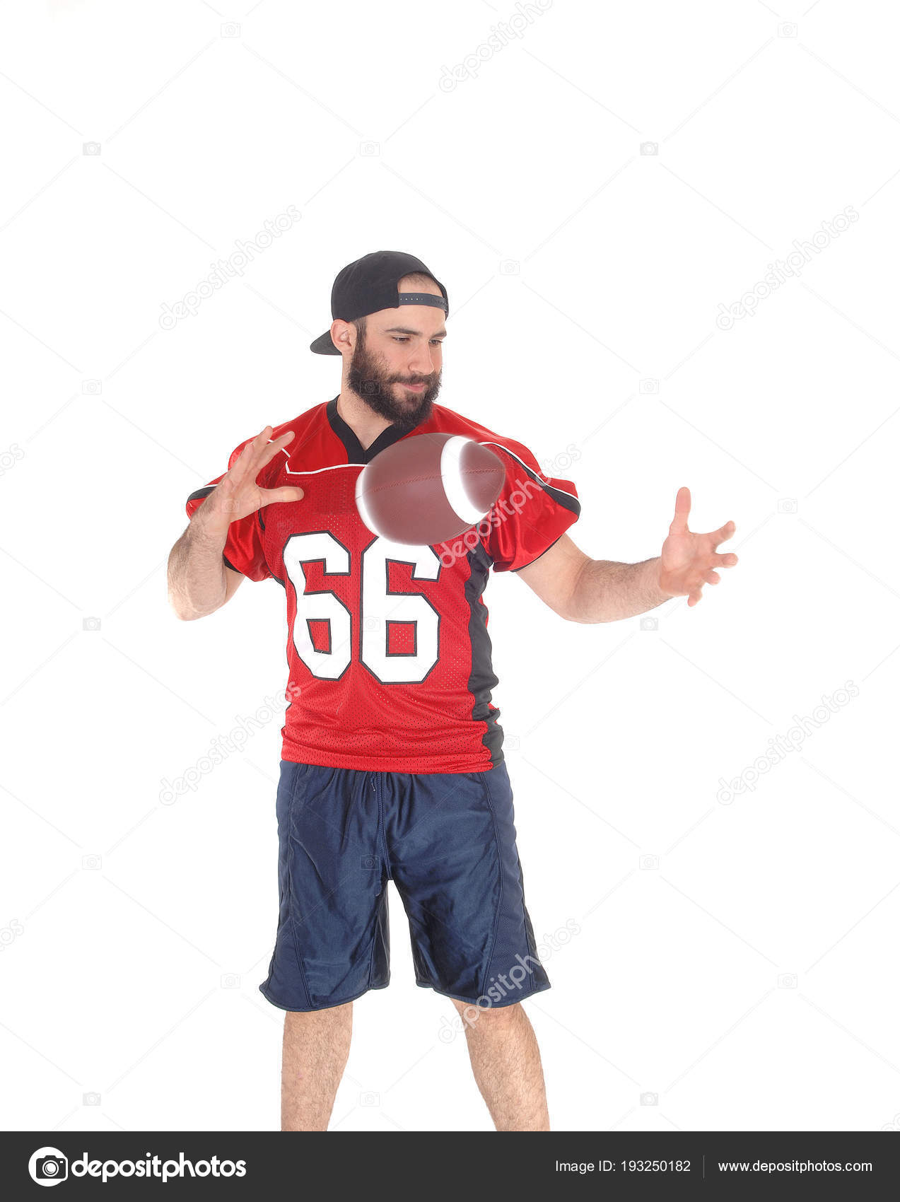 A football player throwing the ball from hand to hand — Stock Photo ...
