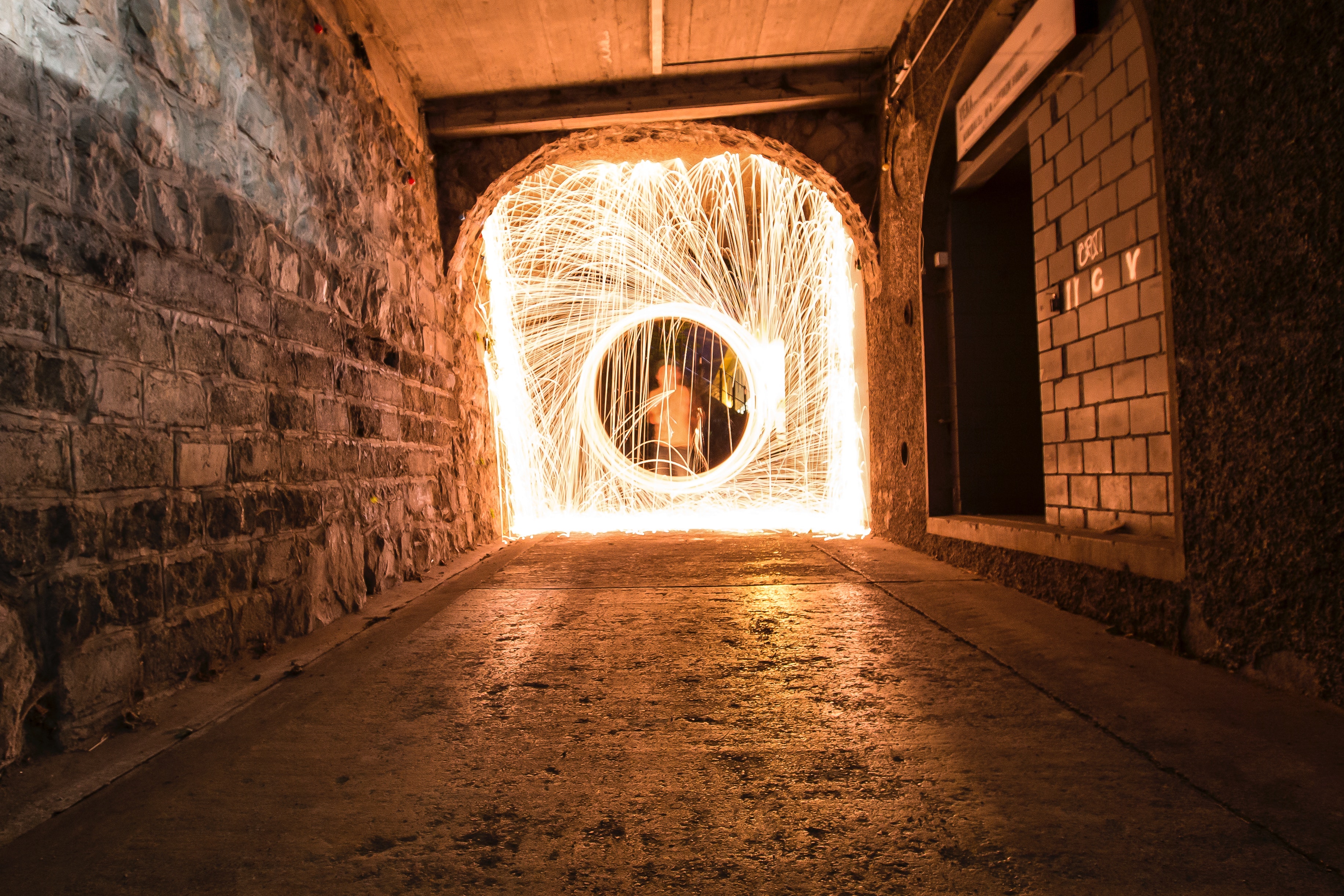Timelapse photo of man in hallway with light