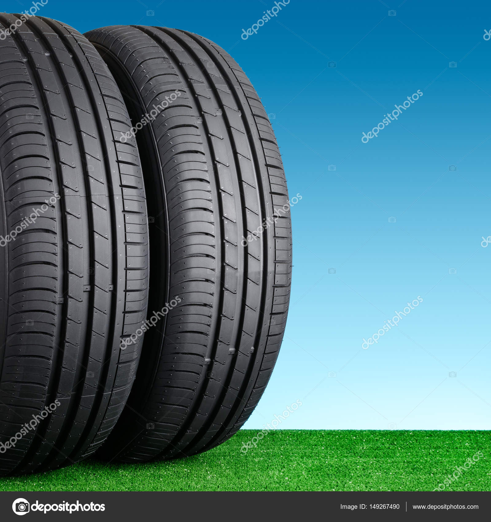 Summer car tires on grass — Stock Photo © RamiF #149267490