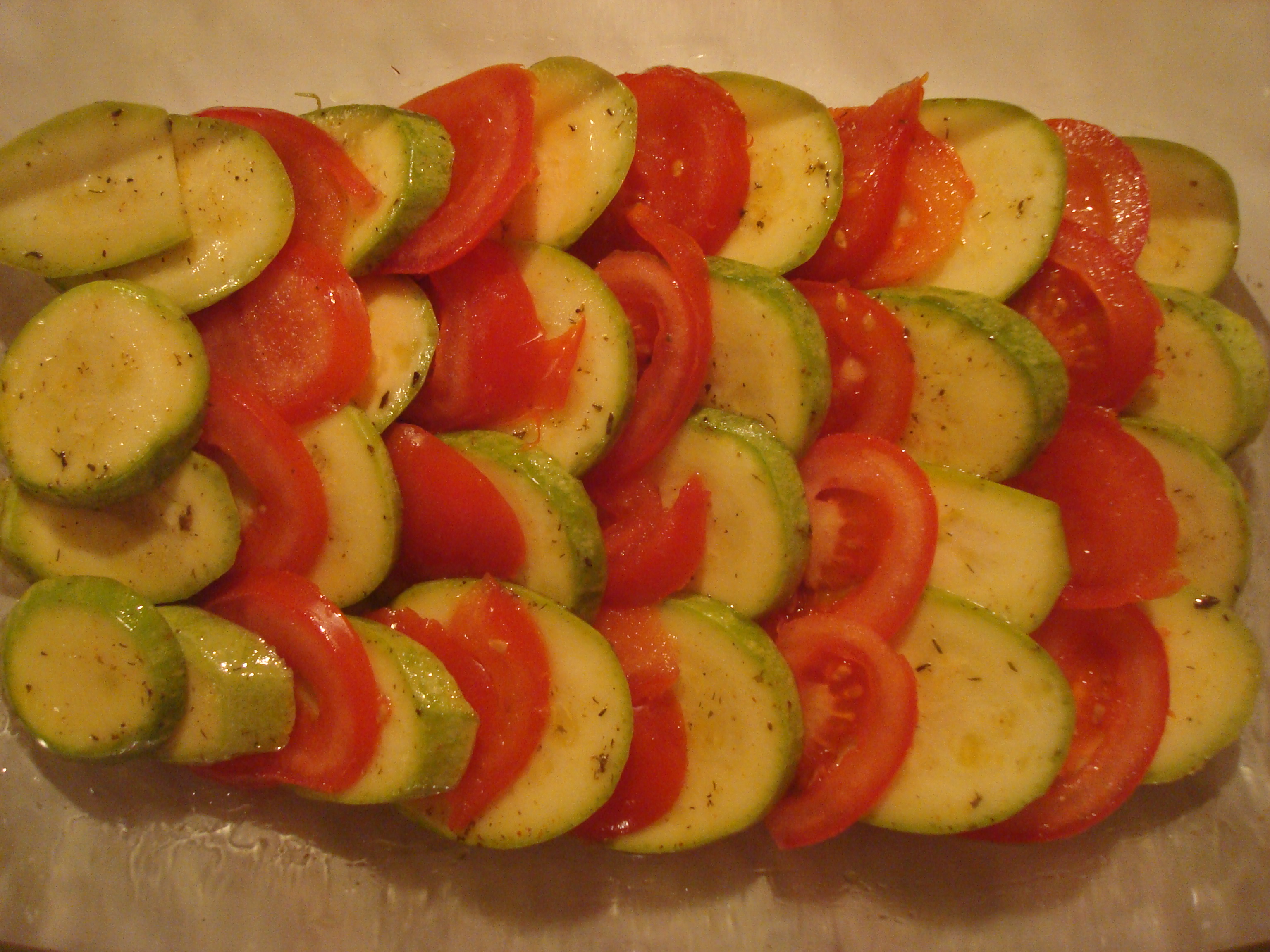 Tomatoes and zucchini dish in preparatio photo