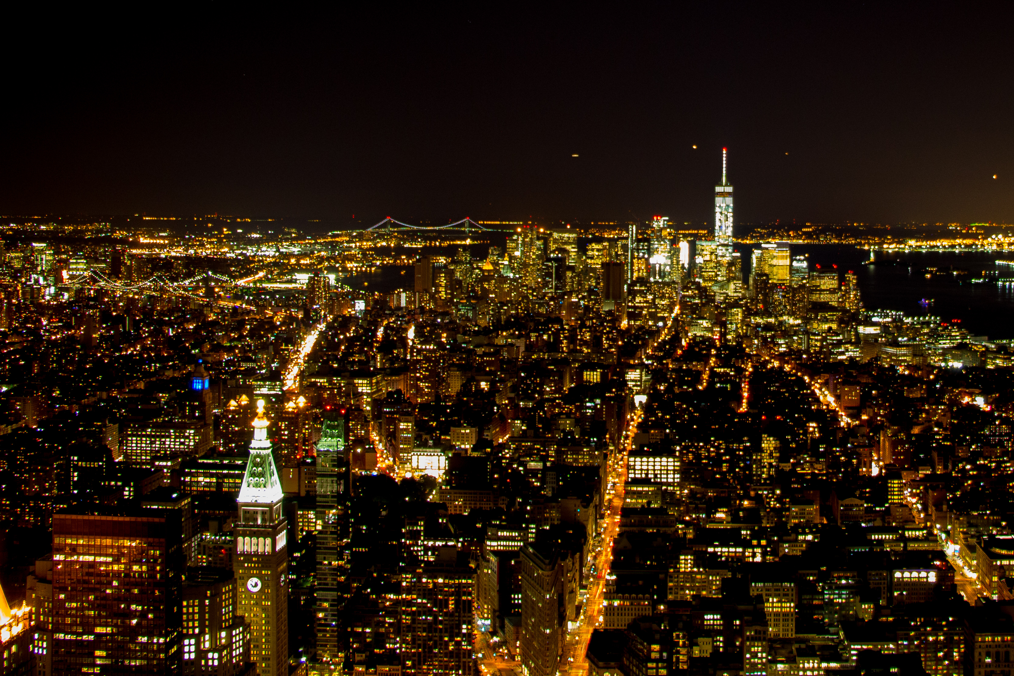 Top of the empire state at night photo
