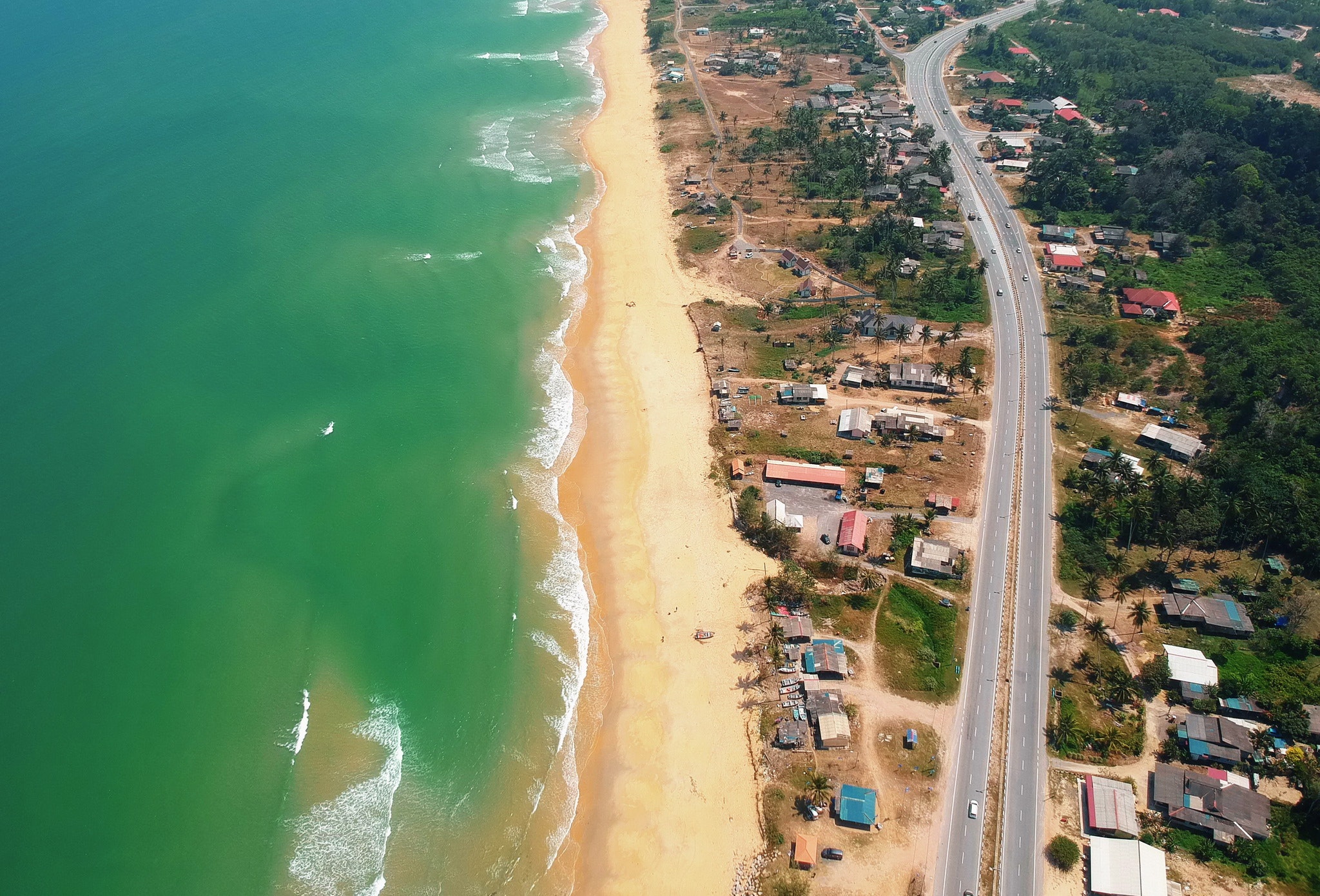 Top view of blue sea and brown sand photo