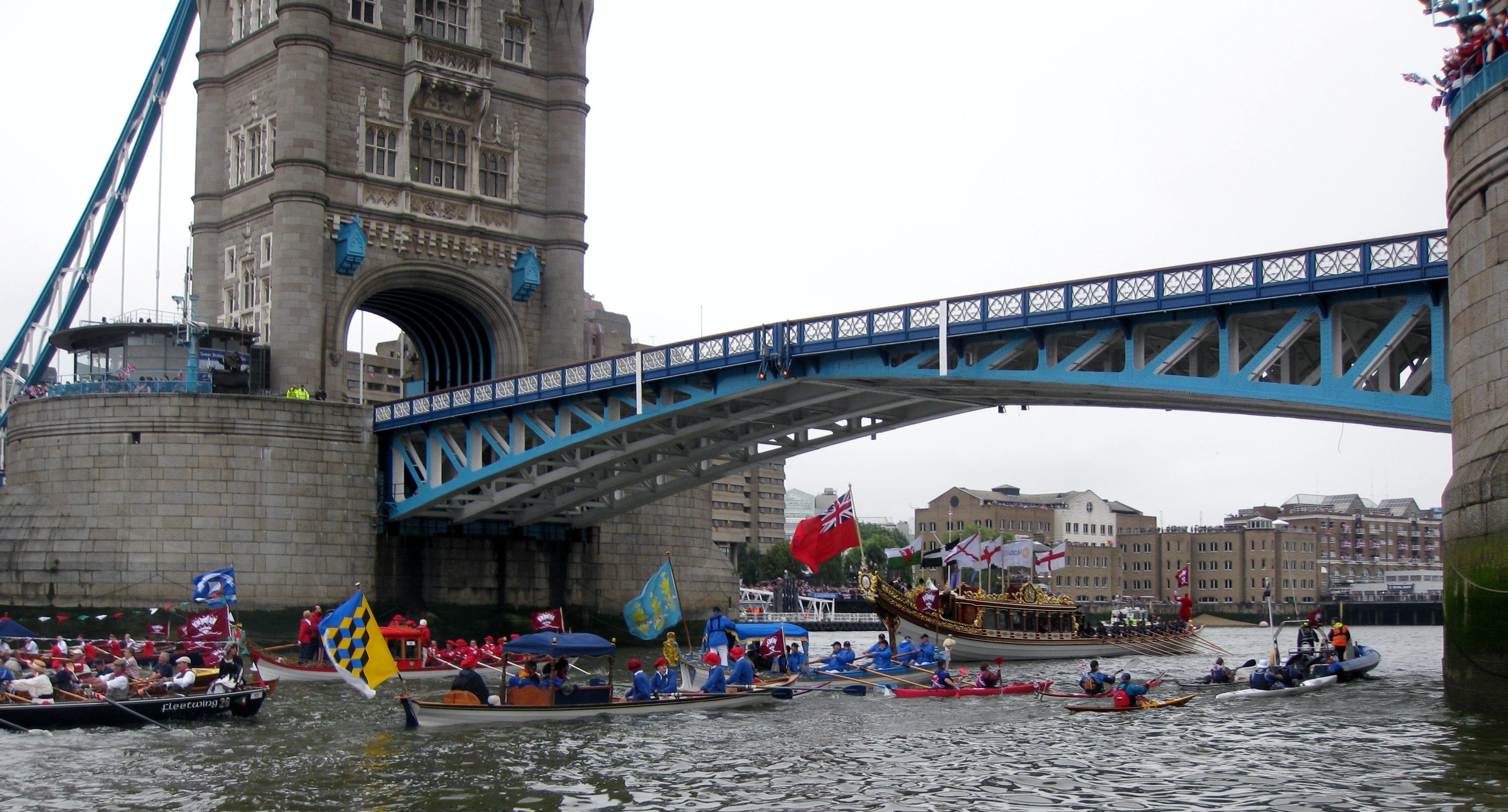 Flotilla Under Tower Bridge – Gloriana, The Queen's Rowbarge