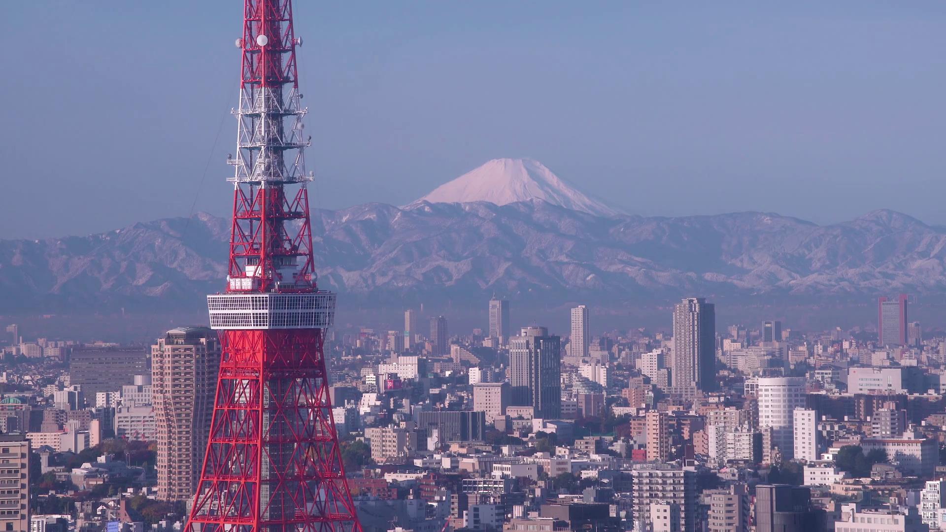 Japan, Tokyo, city skyline with Tokyo Tower and Mount Fuji beyond ...