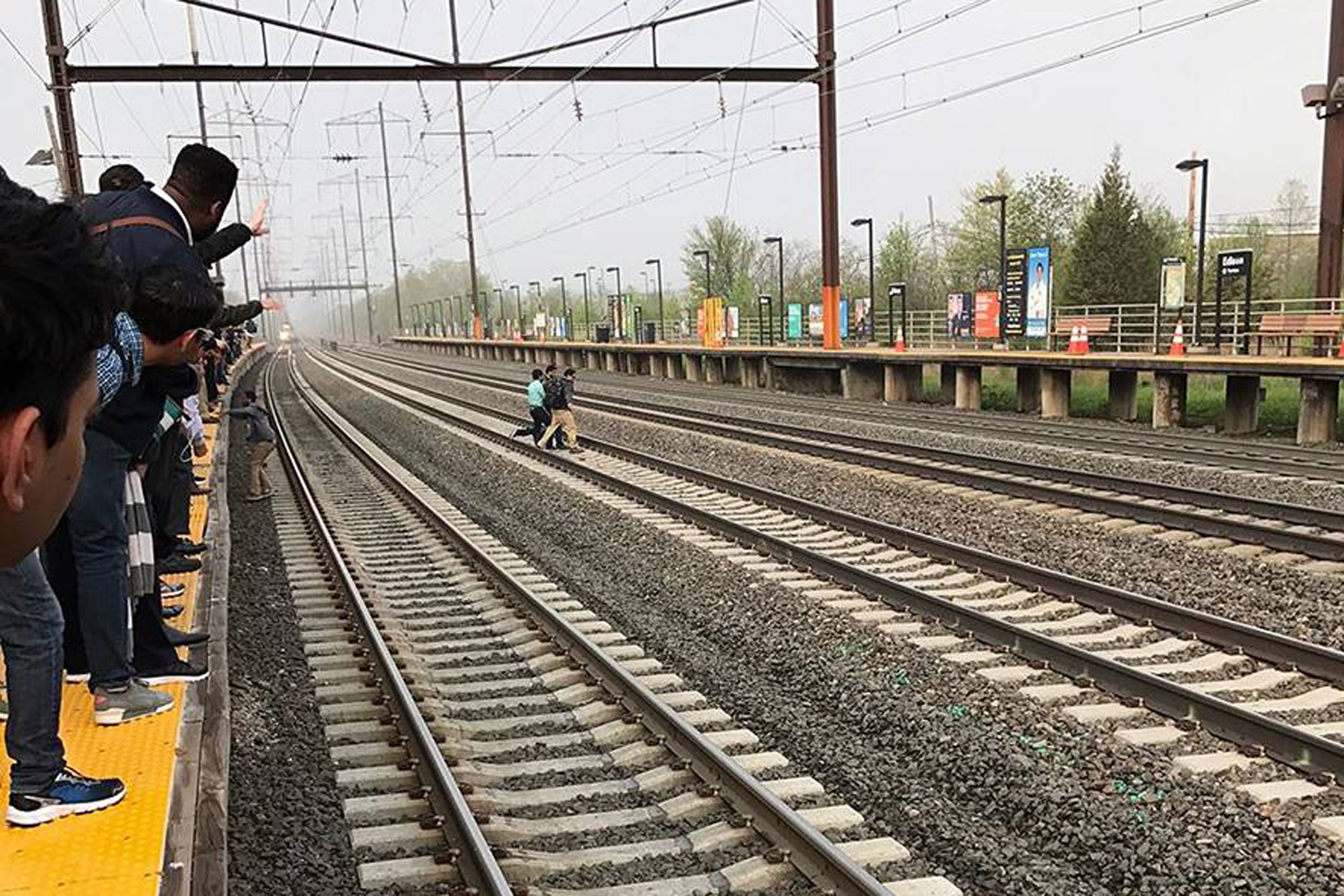 Jerk steals backpack from guy saving woman on train tracks