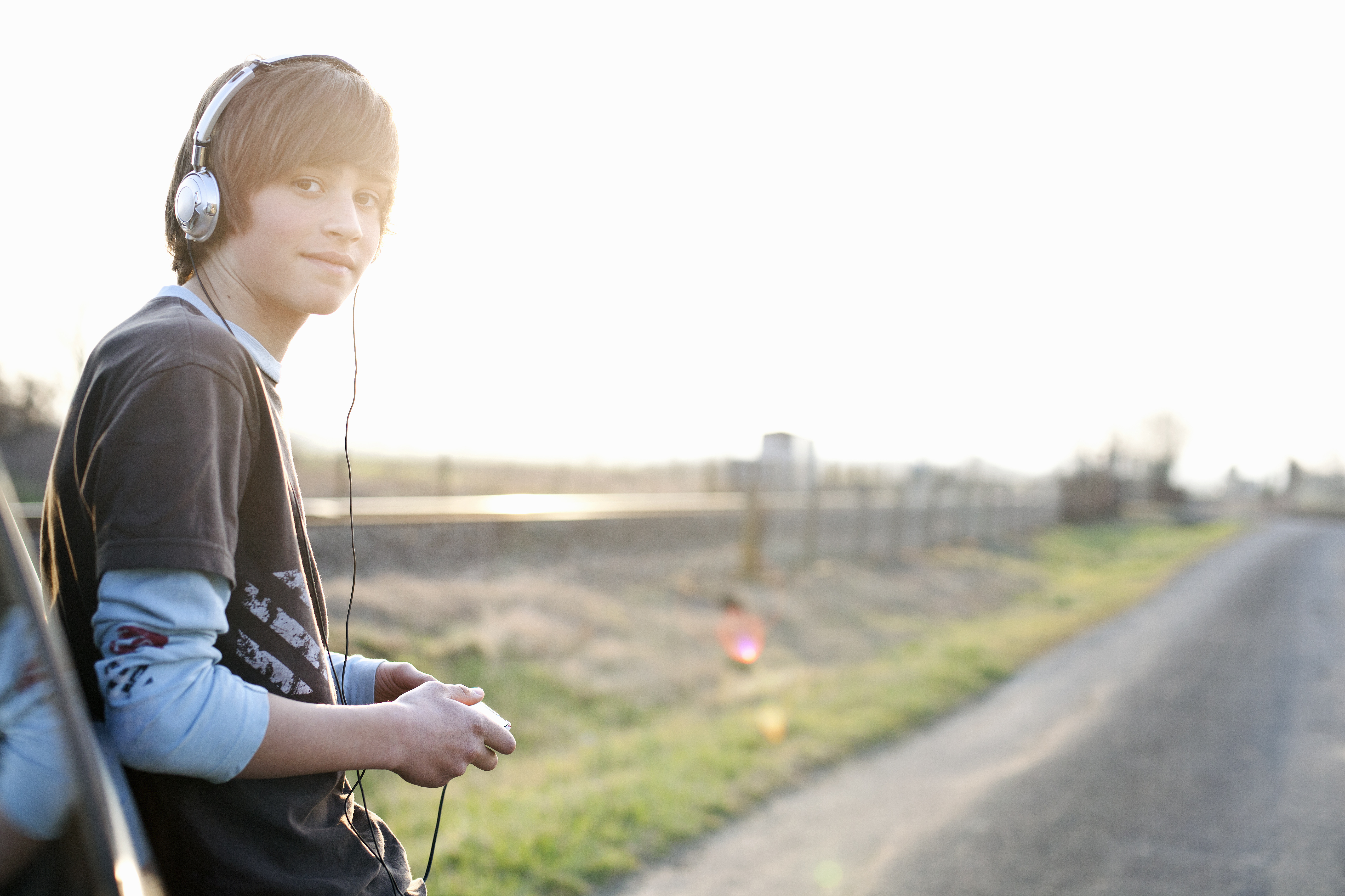 20 tips for travelling with children Teenage boy with headphones by ...
