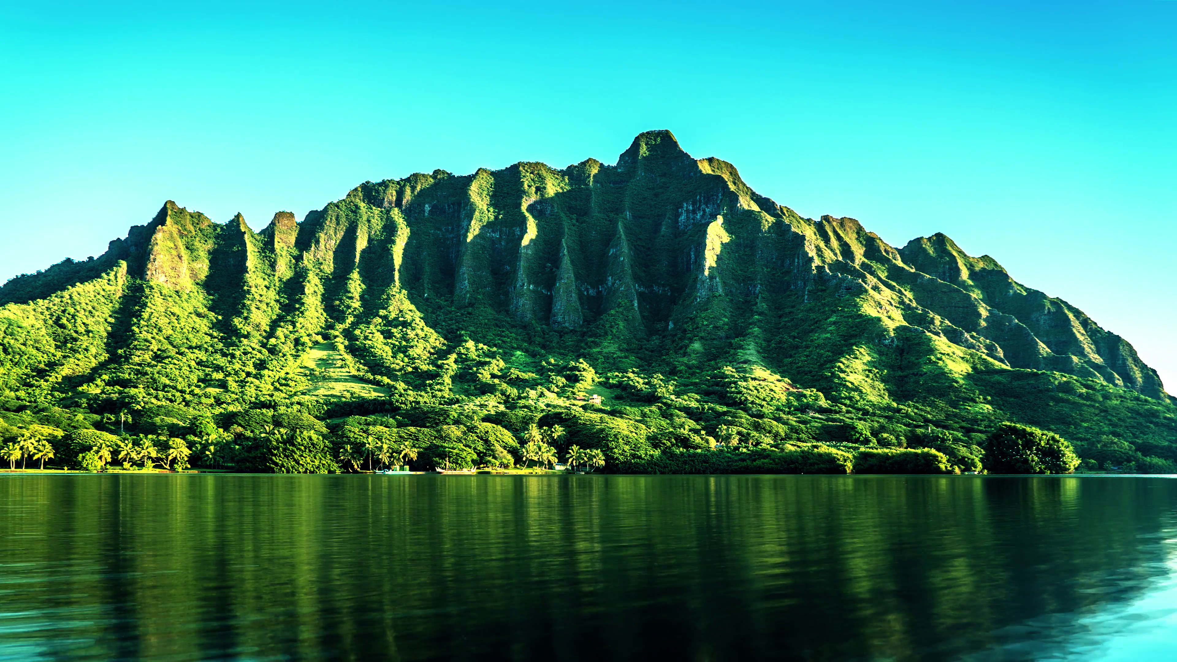 Sunrise over Steep Tropical Mountains on Calm Lake in Hawai'i in 4K ...