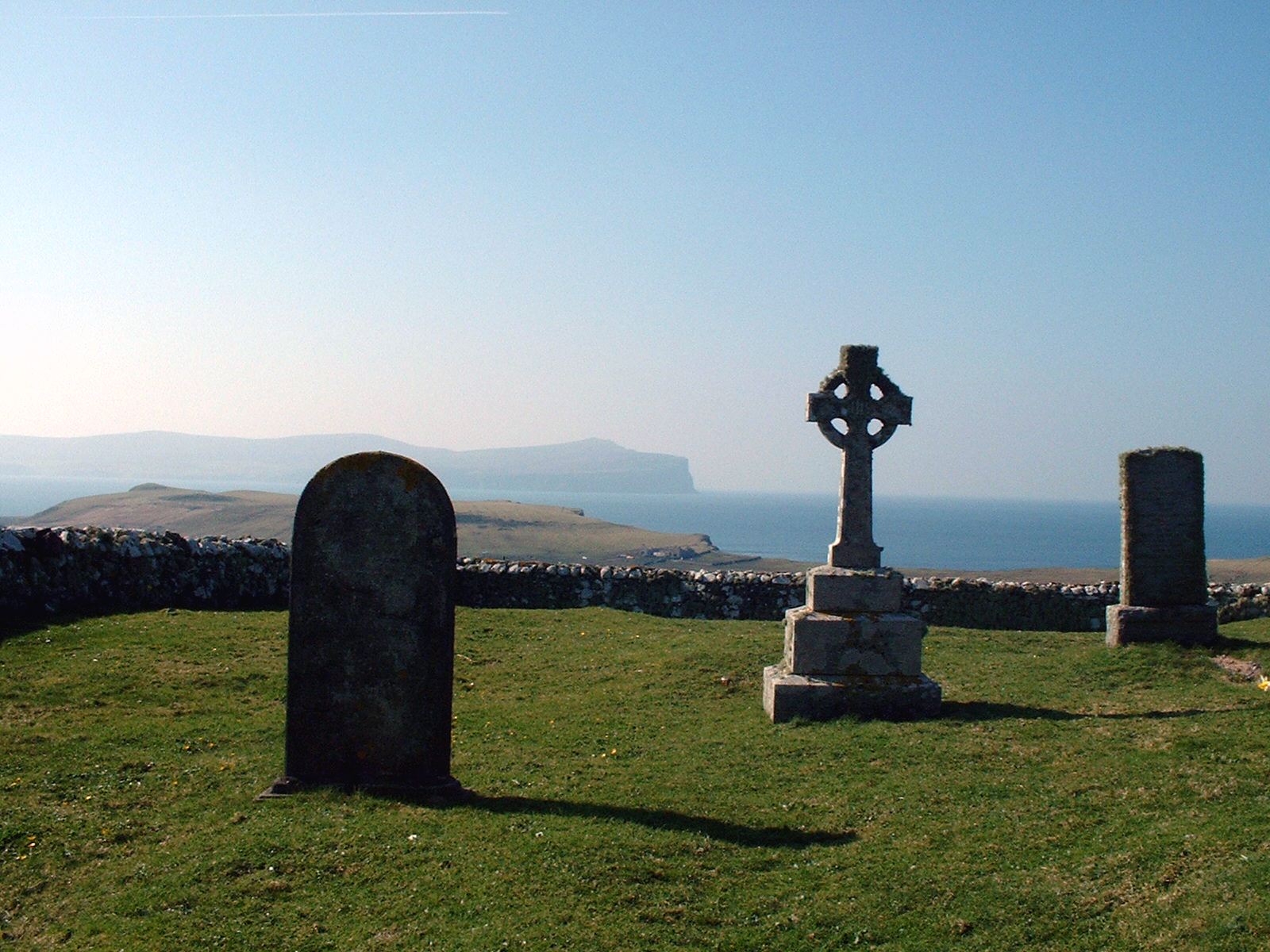 Trumpan churchyard and celtic cross photo