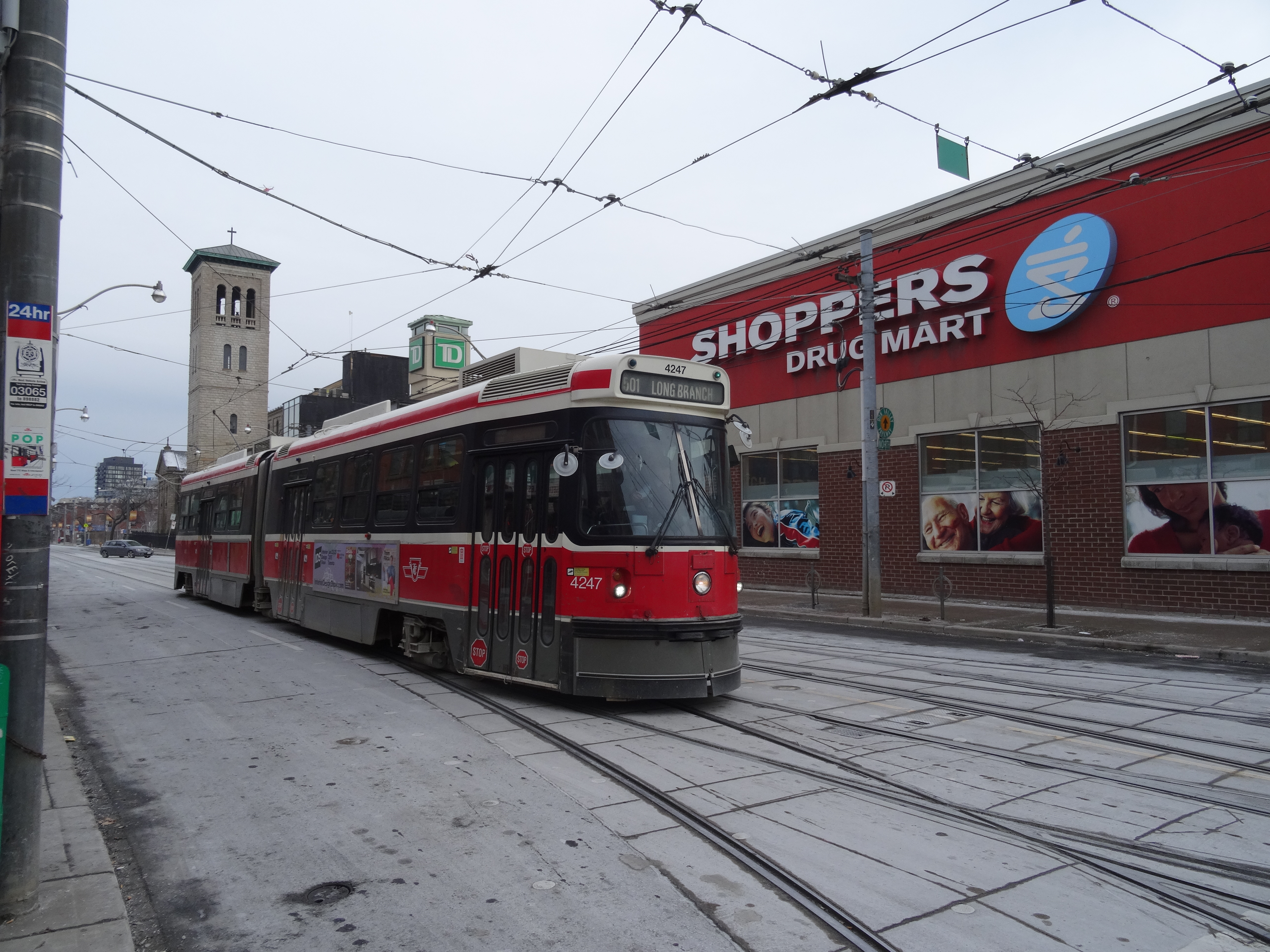 Ttc vehicles at the intersection of parliament and queen, 2015 01 17 (1) photo