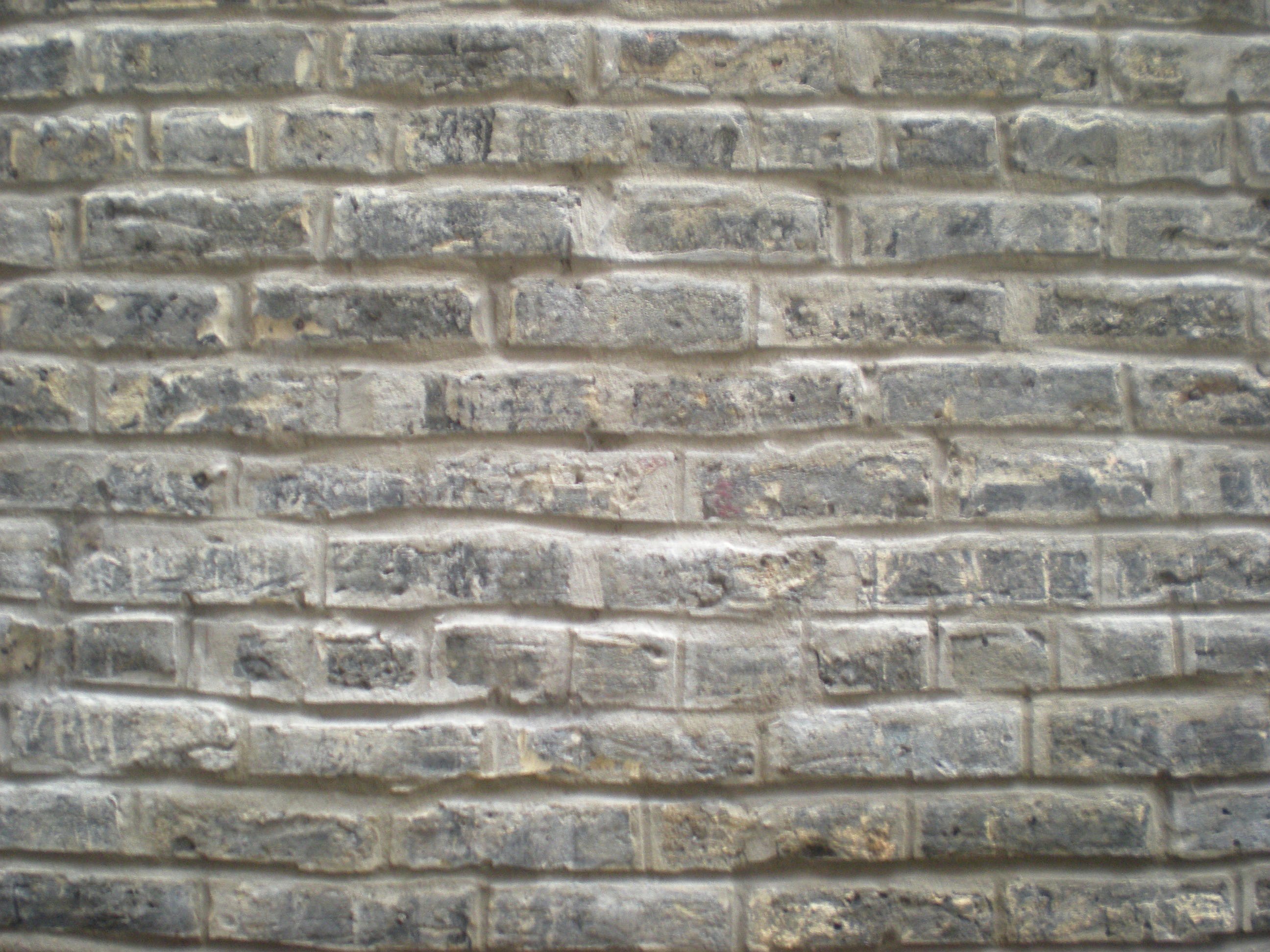 Tuckpointed horizontal light brick wall photo