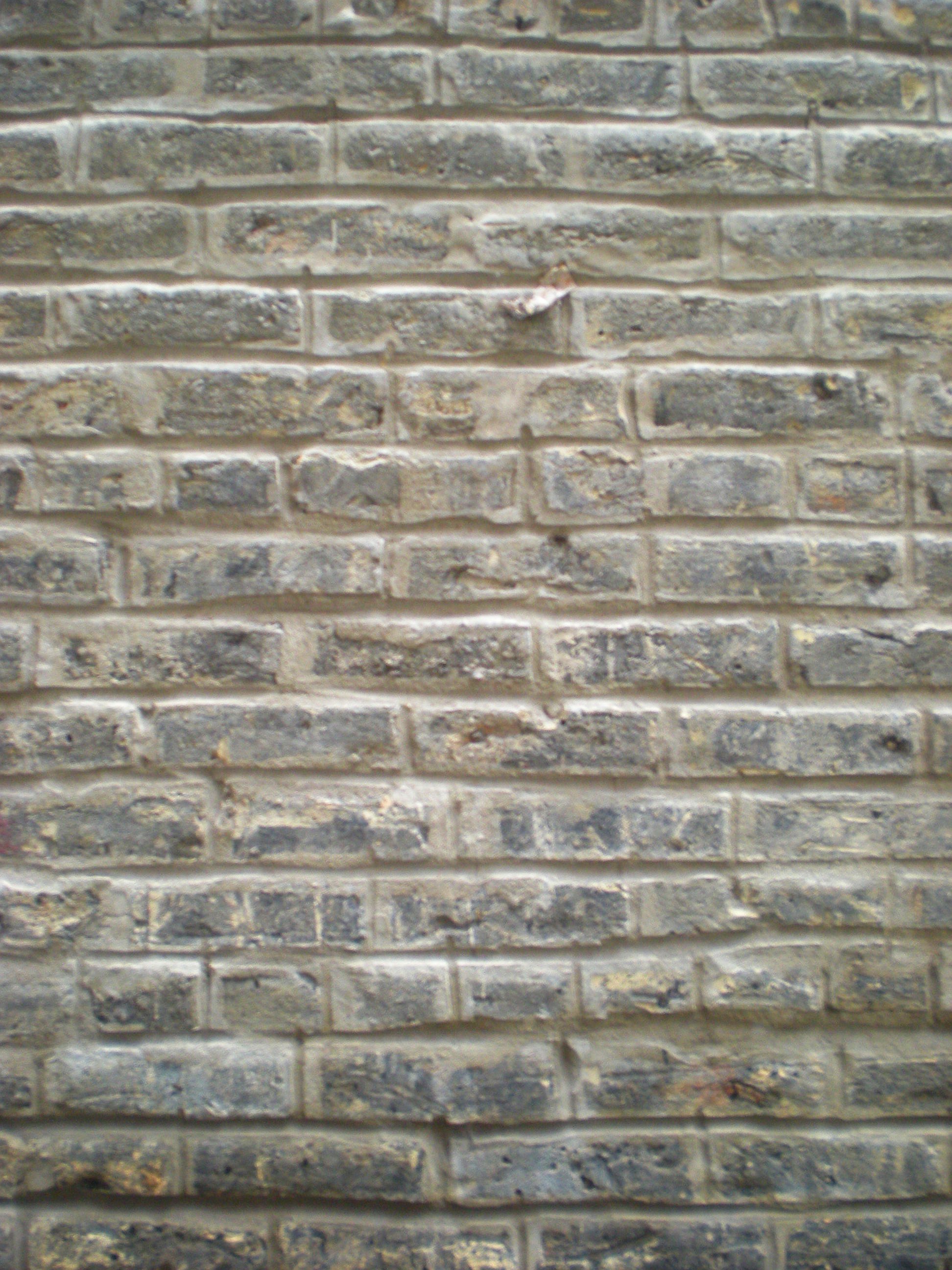 Tuckpointed vertical light brick wall photo