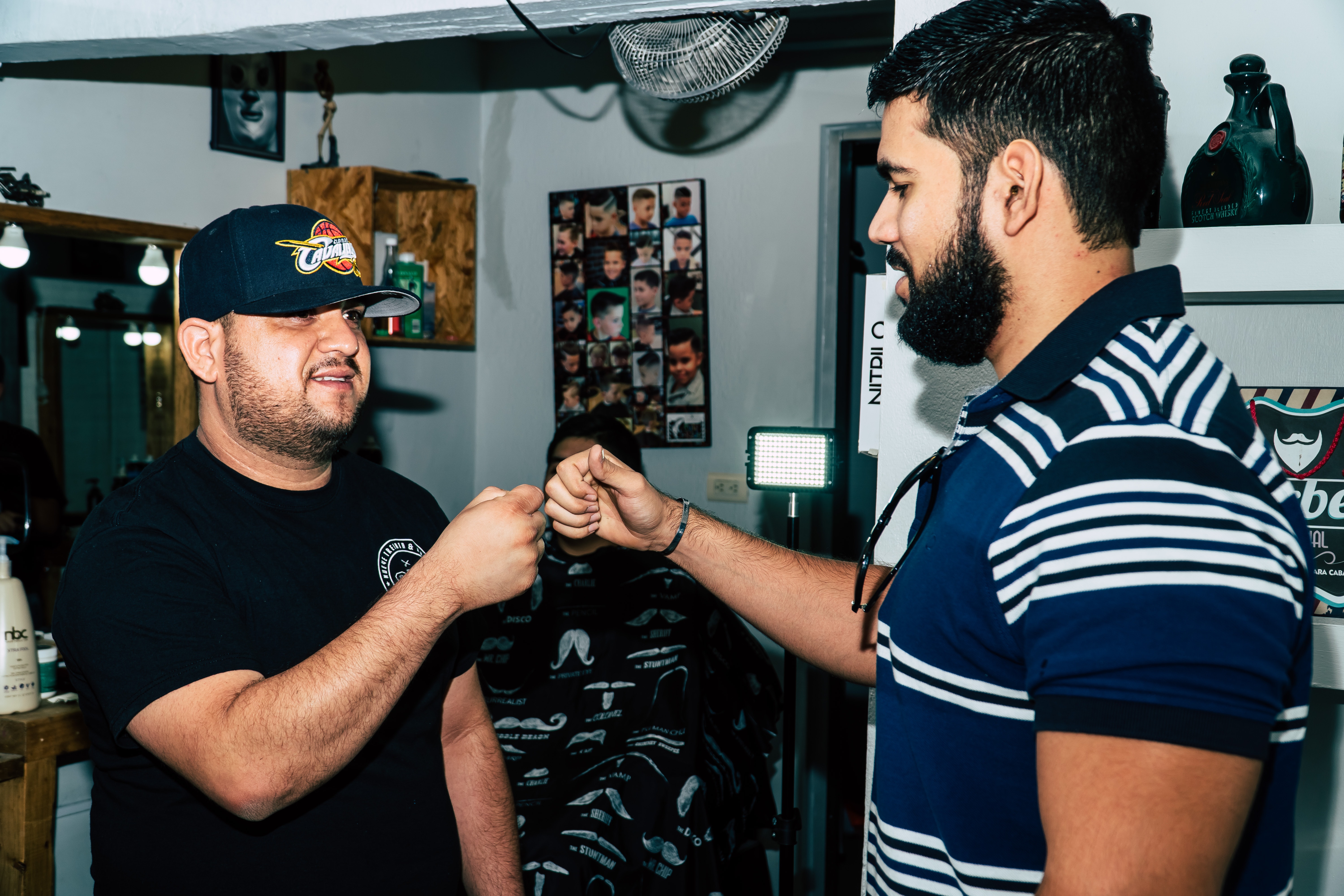Two bearded man giving each other fist bump photo