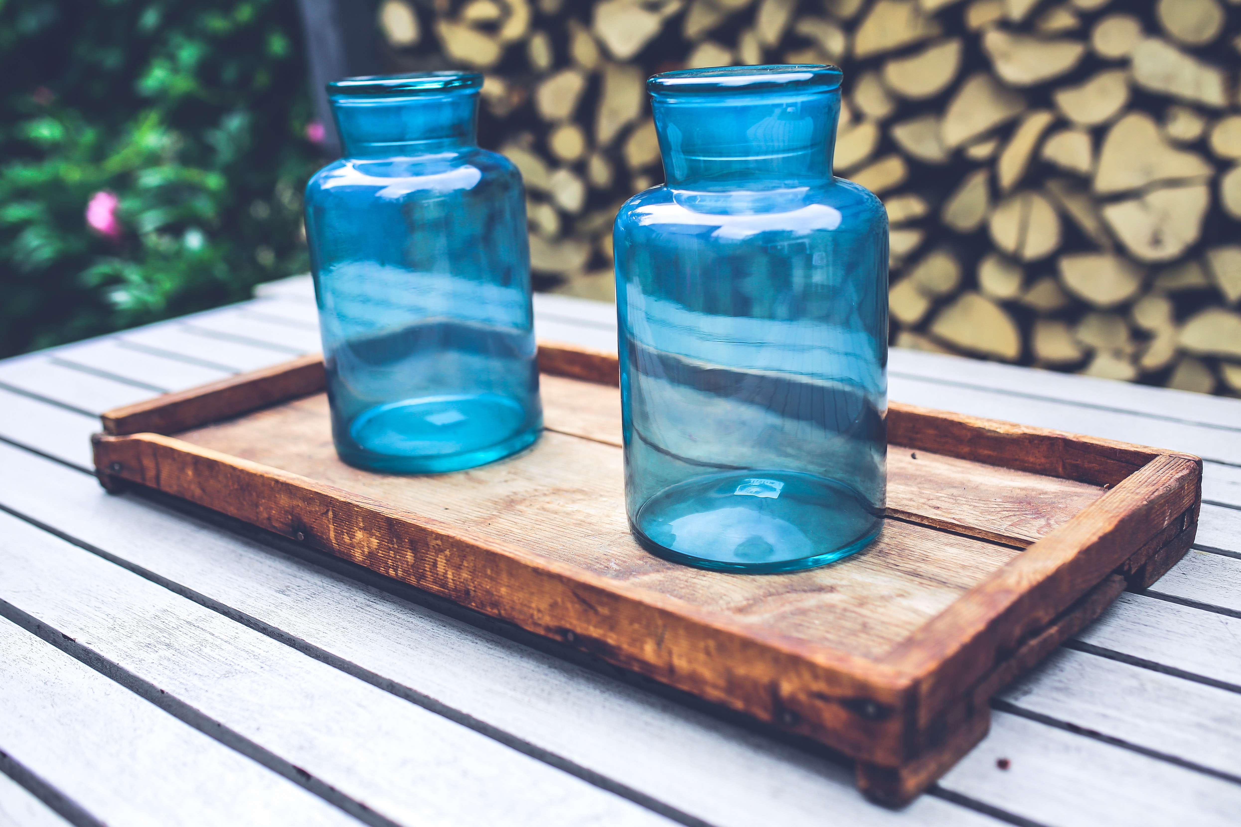 Two blue jars on the wooden tray photo