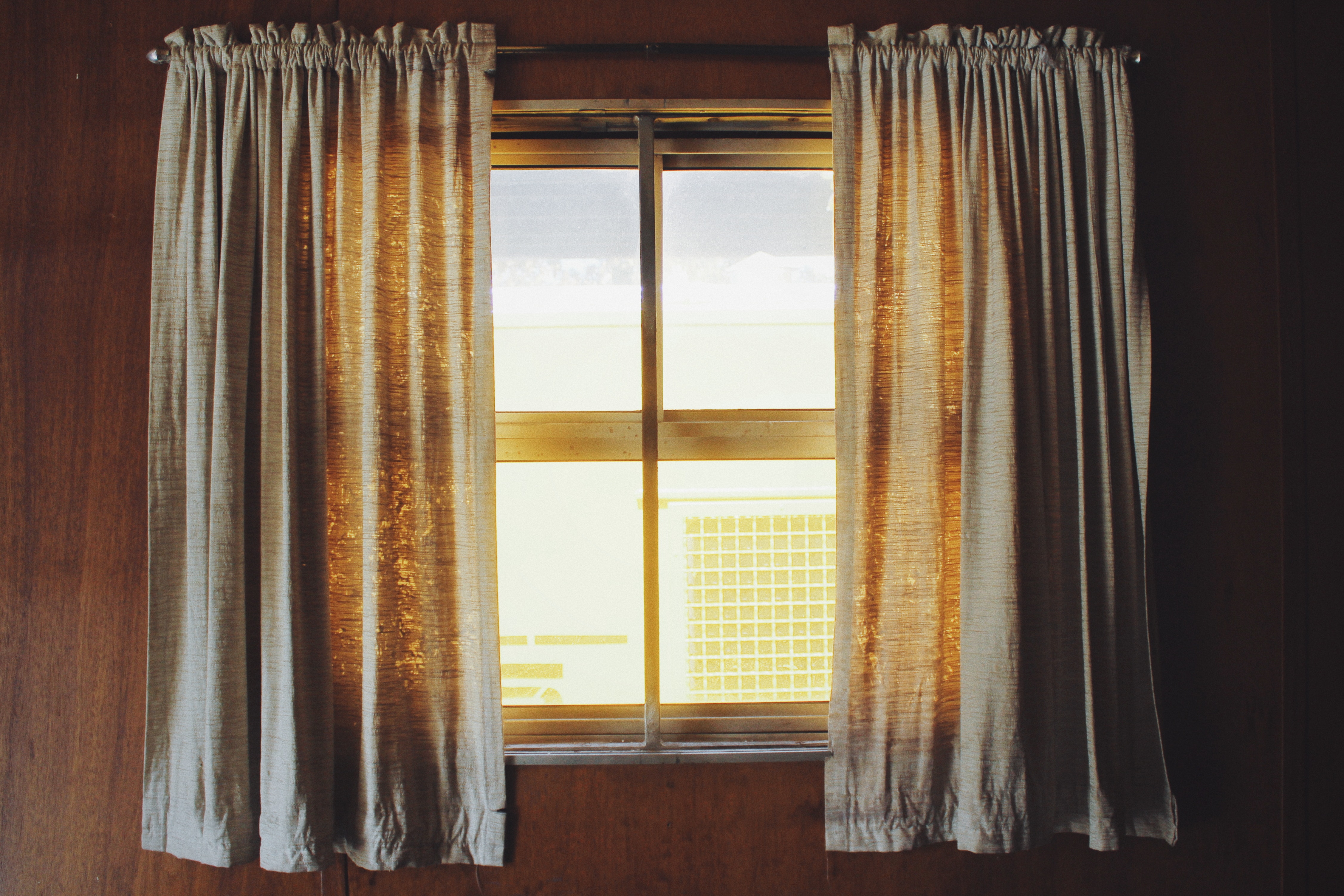 Two white rod pocket curtains photo