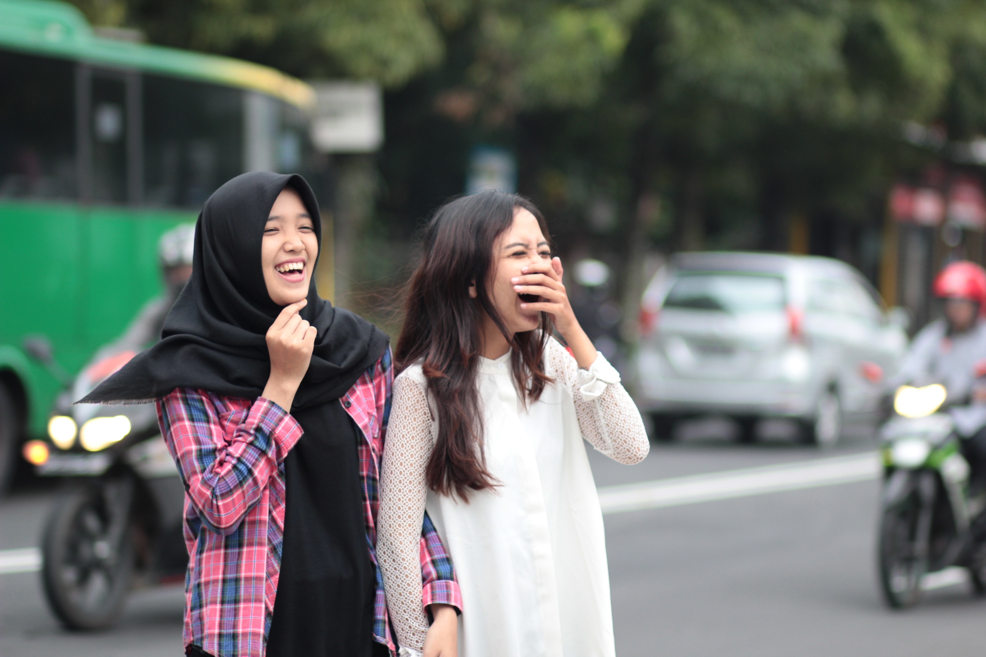 Two women laughing at street photo