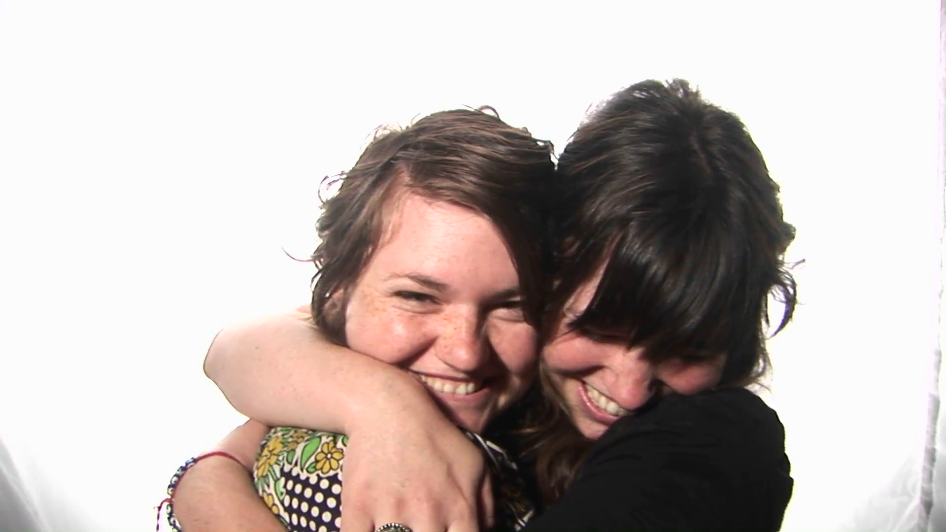 Two young women share a hug. Stock Video Footage - Videoblocks
