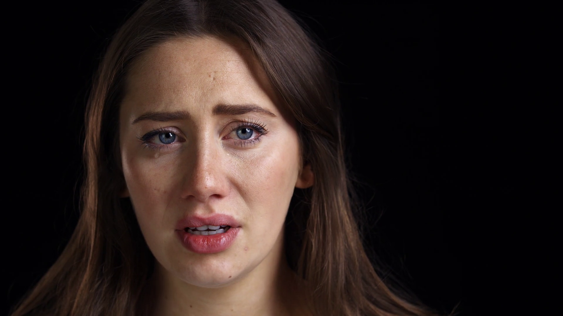 Studio Shot Of Unhappy Young Woman Crying Into Camera Stock Video ...