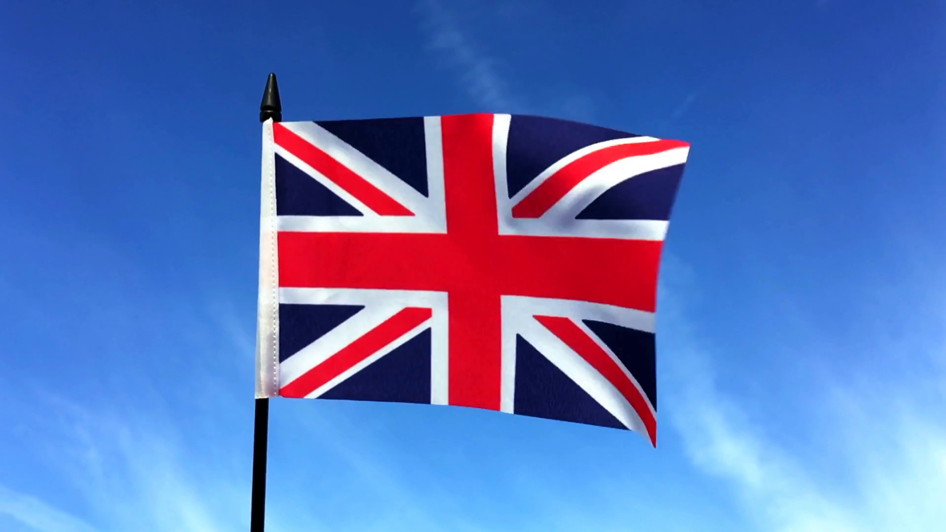 The national flag of Great Britain Union Jack is fluttering in the ...