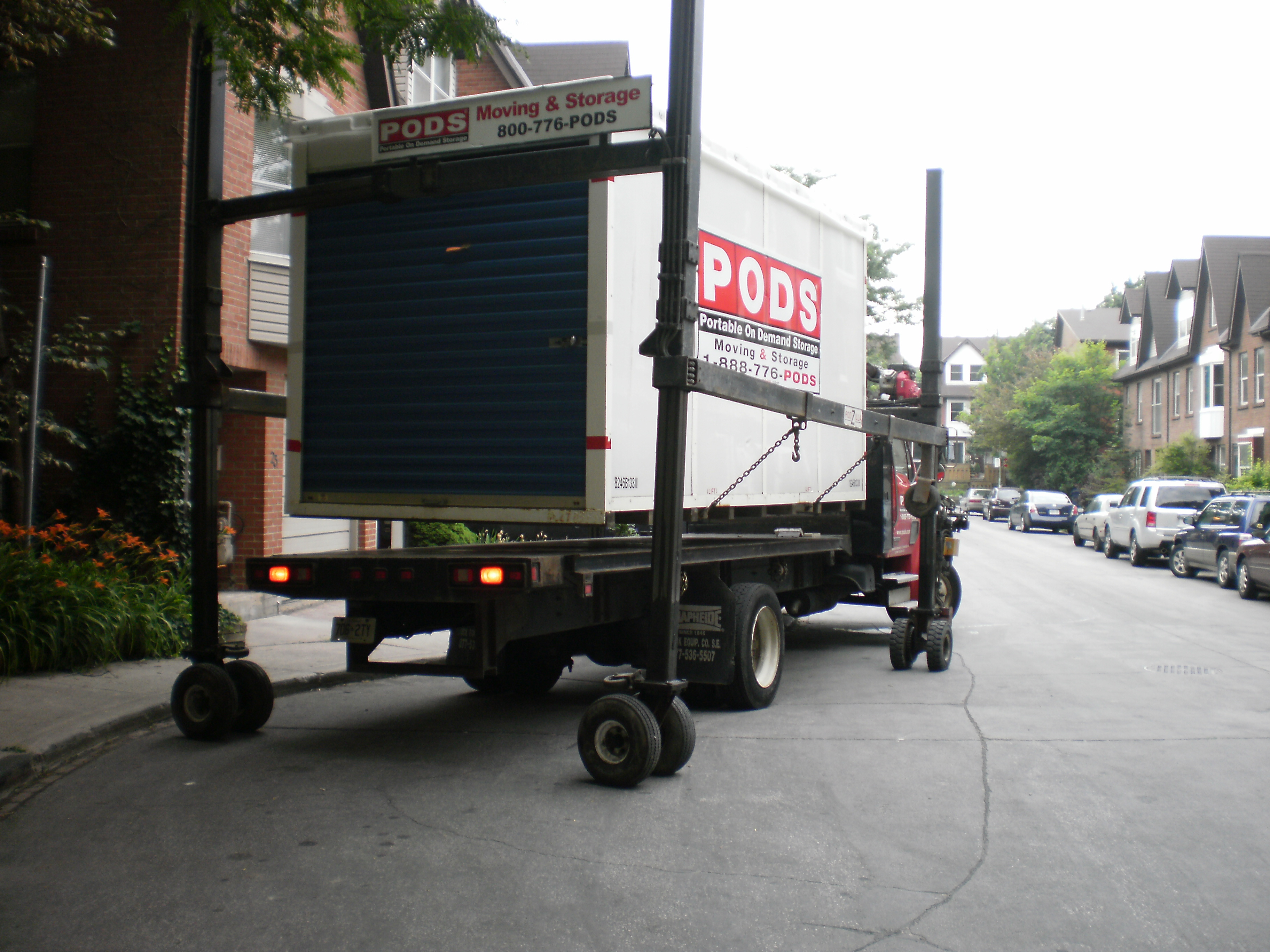 Unloading a shipping container with household contents -f photo