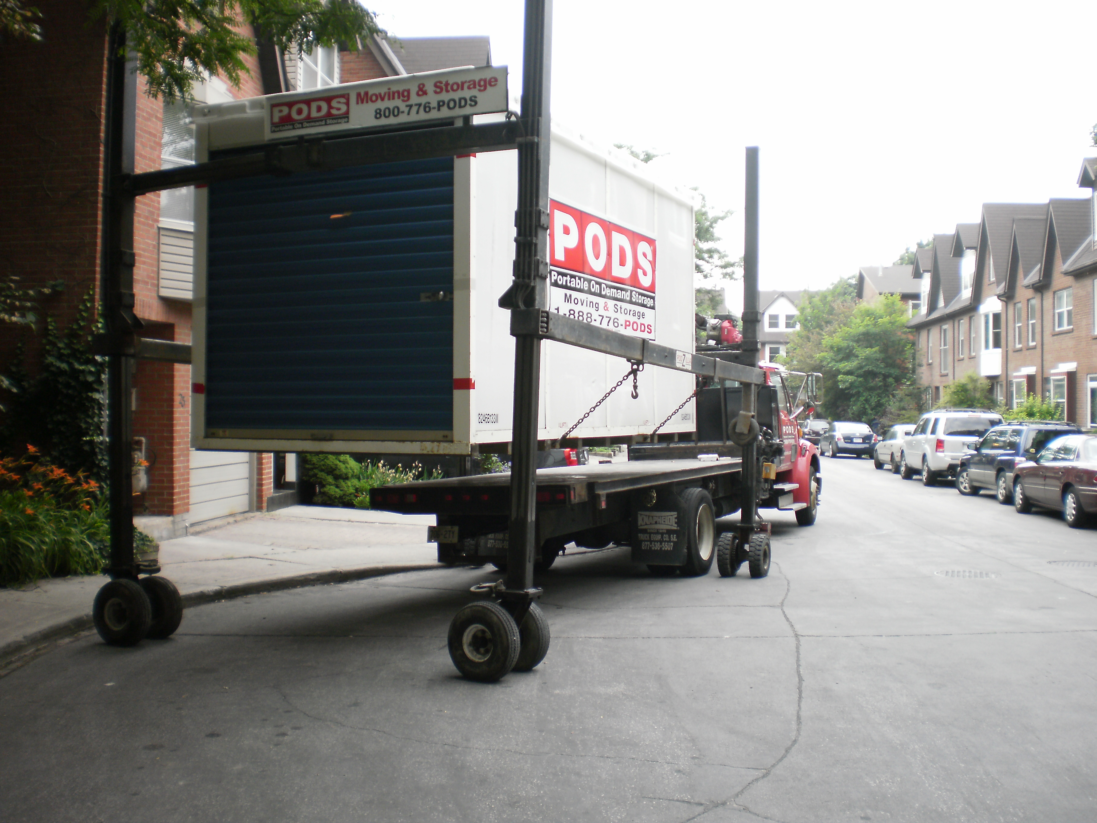Unloading a shipping container with household contents -g photo