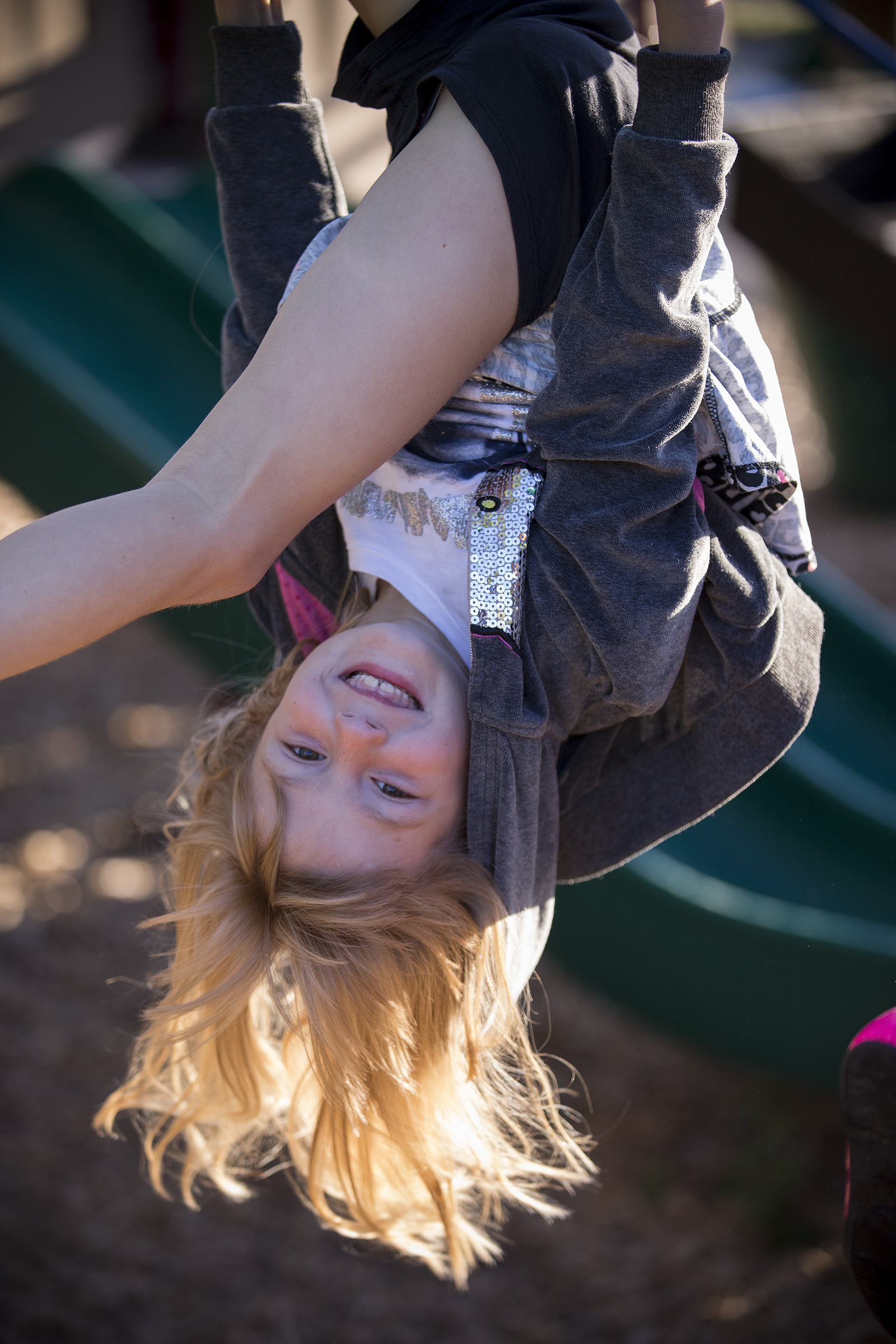 Lower School upside down girl on playground - Manlius Pebble Hill School
