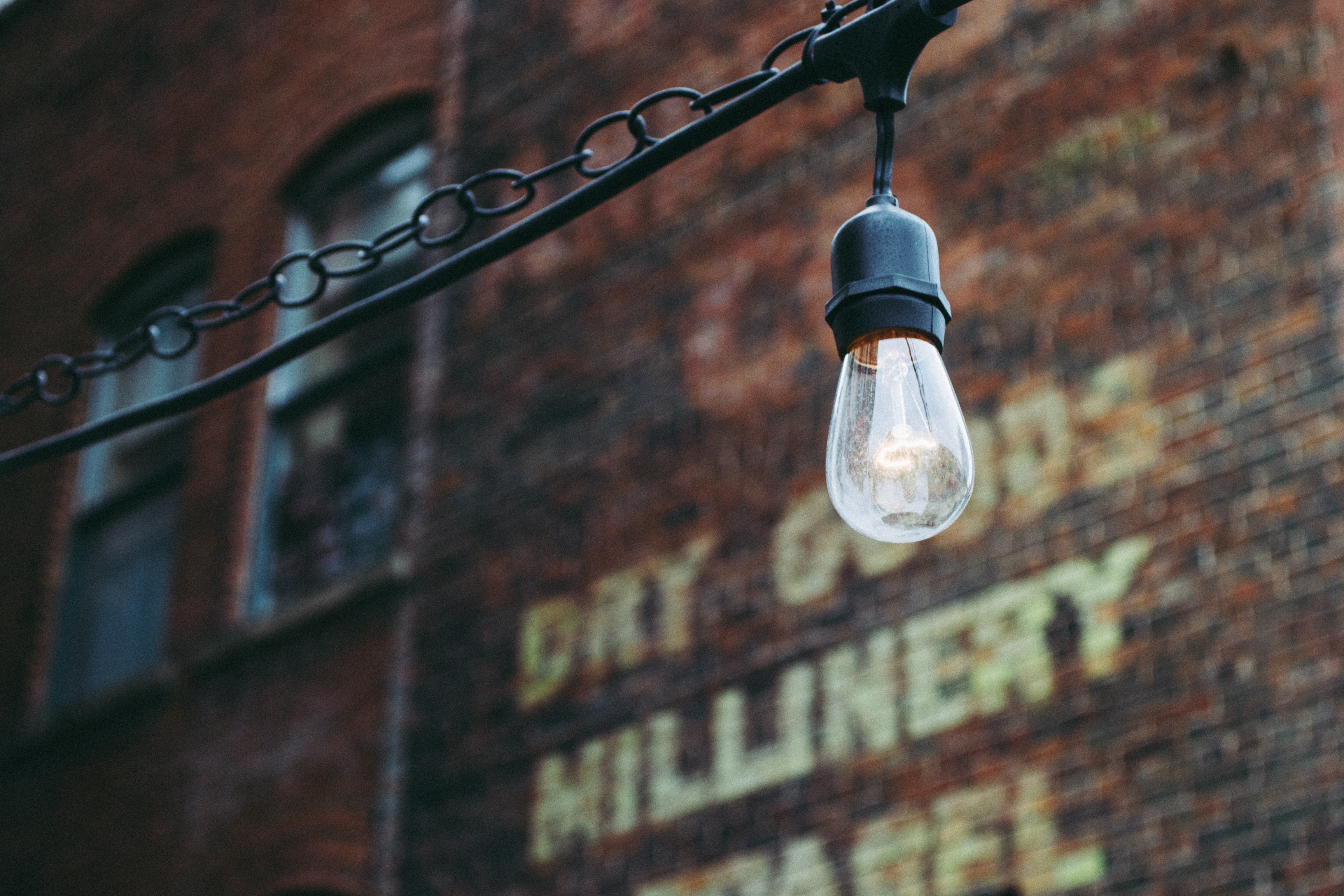 Urban lamp on a brick wall background photo