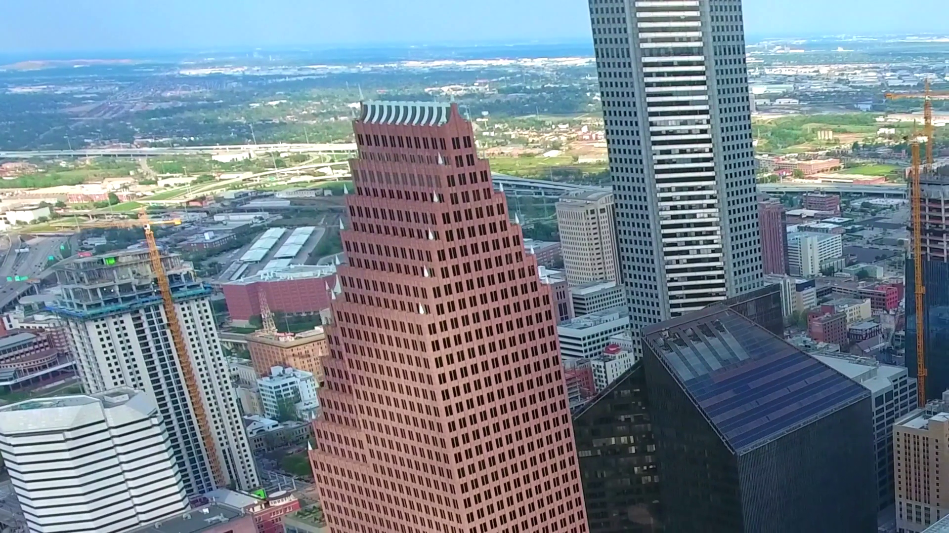 4k aerial panorama drone shot of tall financial district modern ...