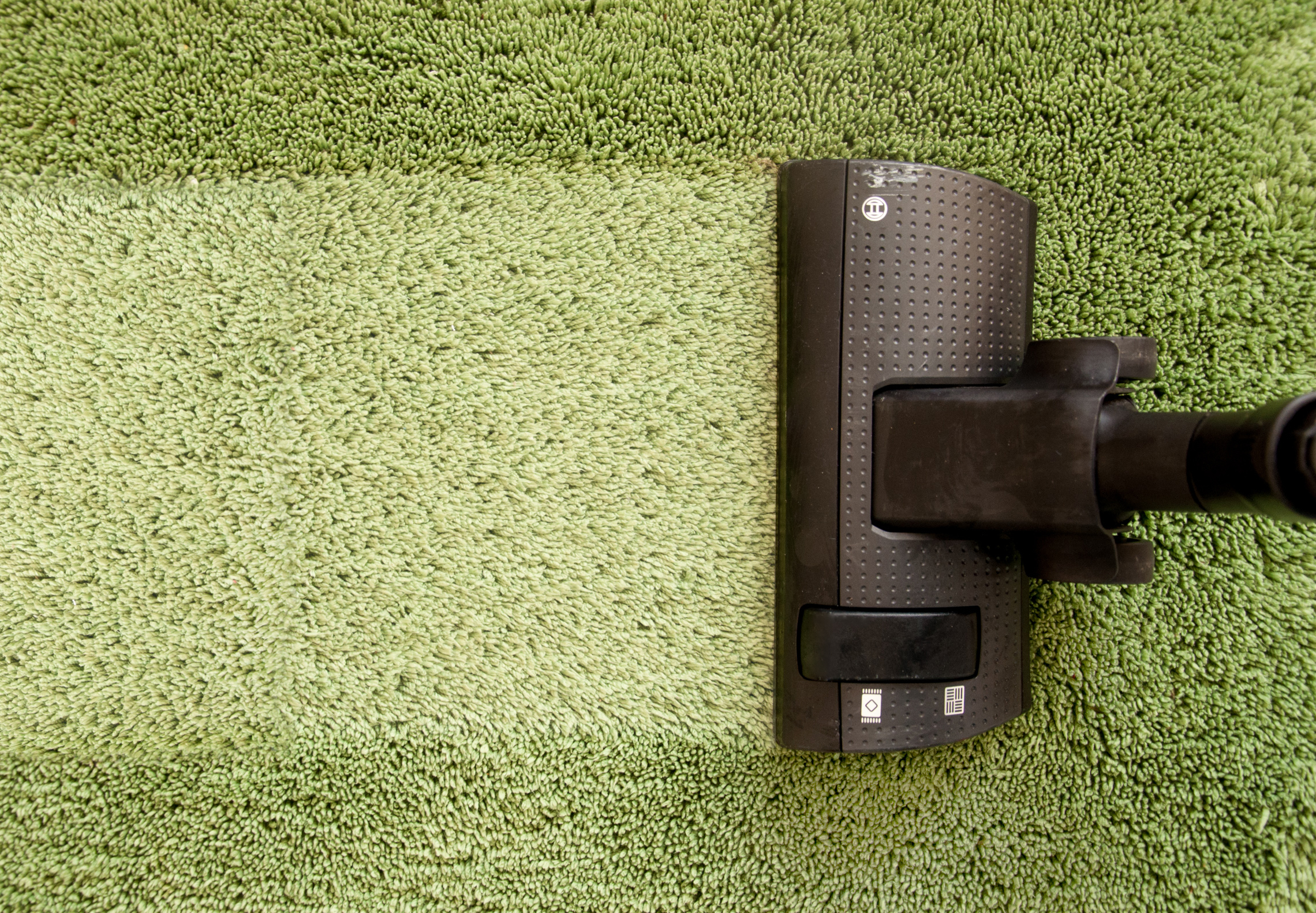 Vacuum cleaner on carpet cleaning photo