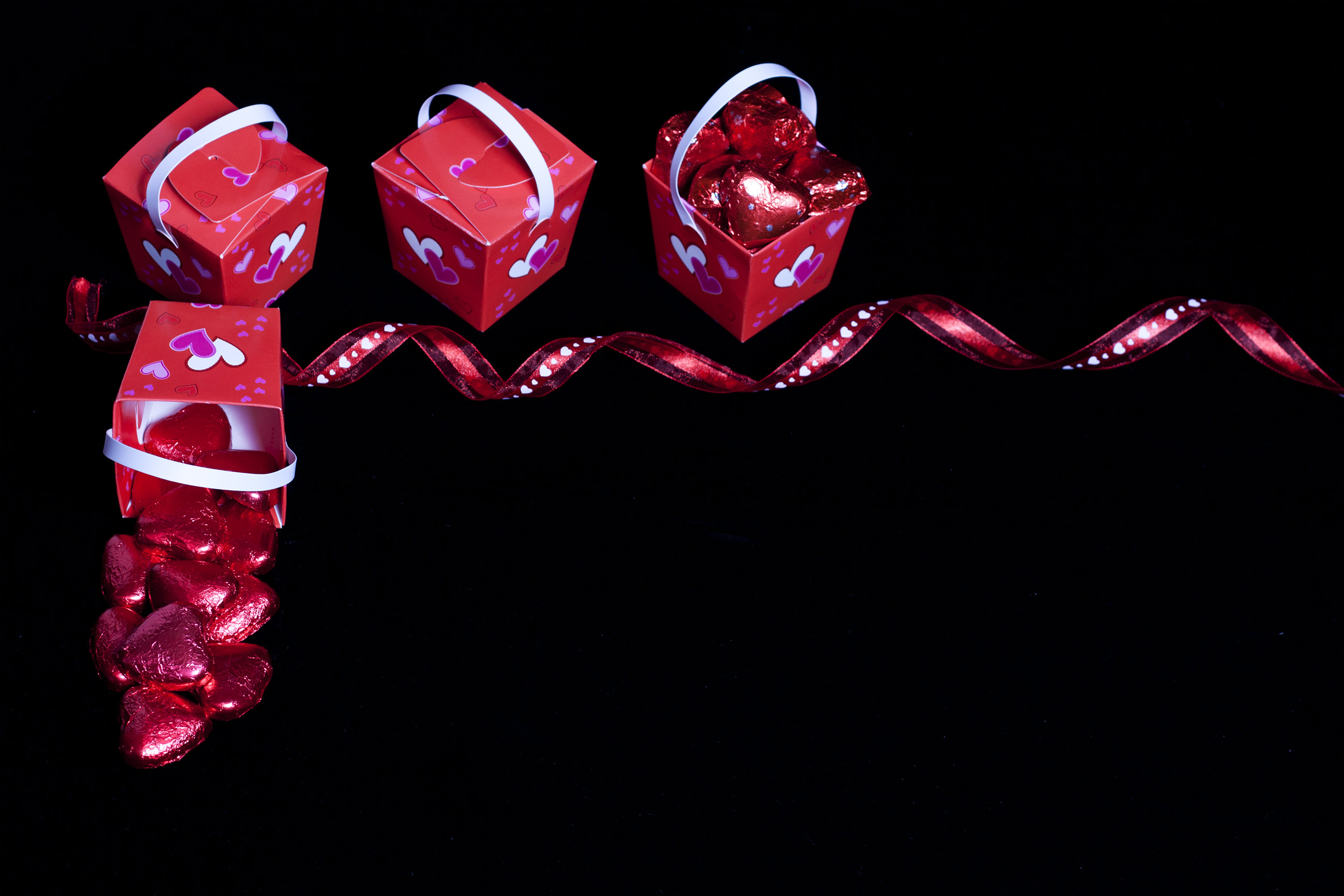 Valentine's day candy, ribbon and boxes photo