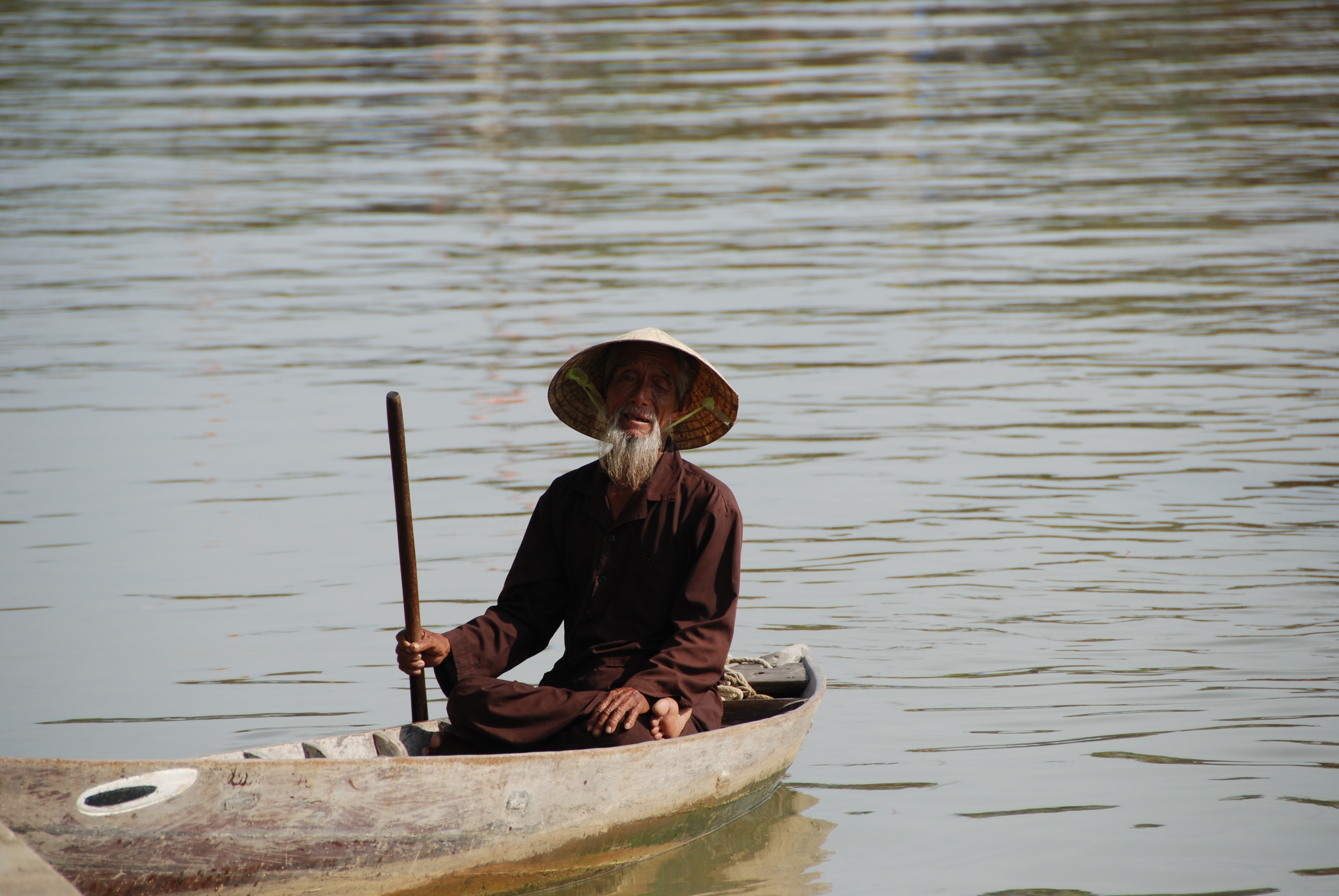 Vietnamese man on a boat photo