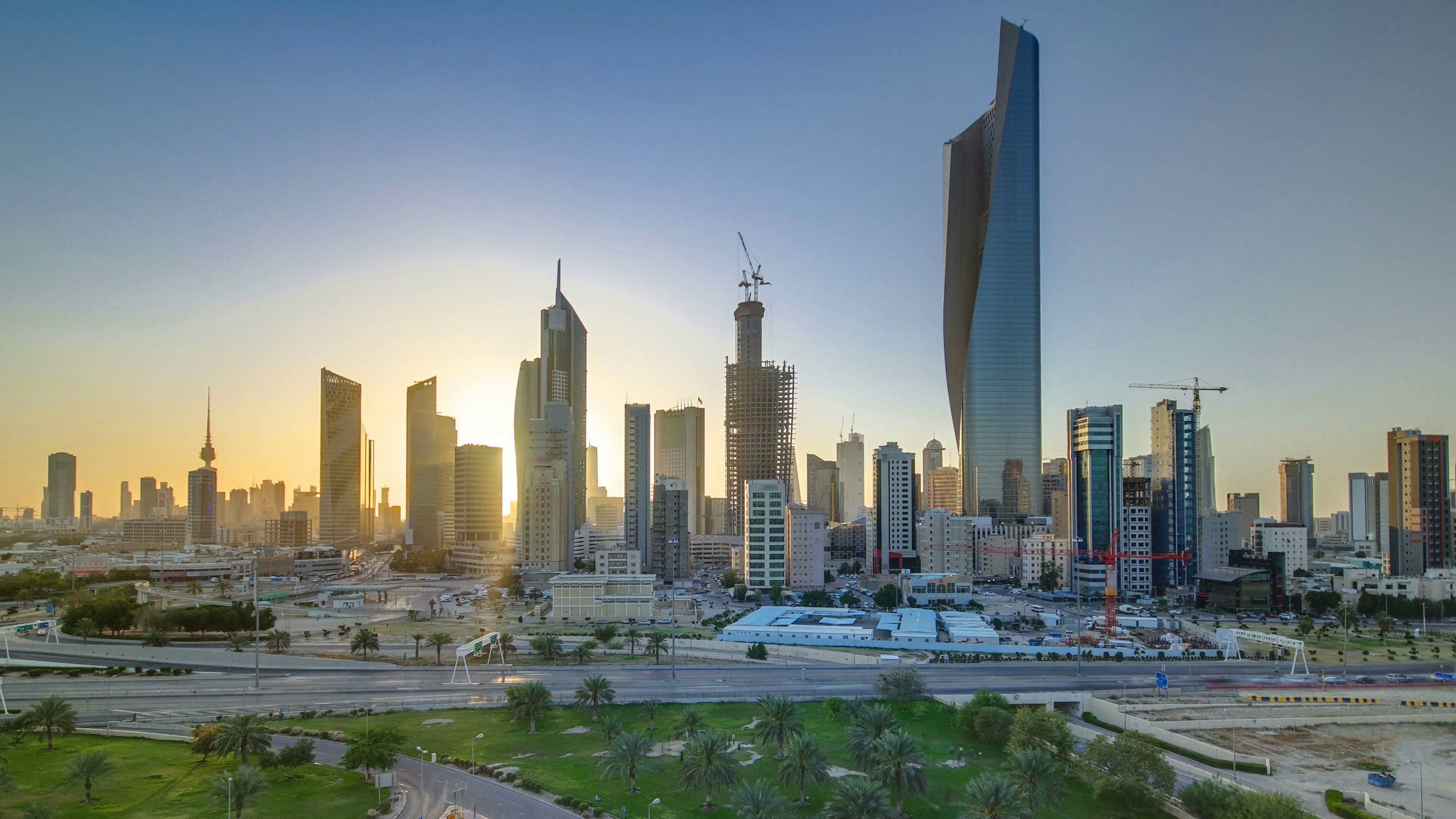 Top view of Kuwait cityscape during the sunset timelapse with modern ...