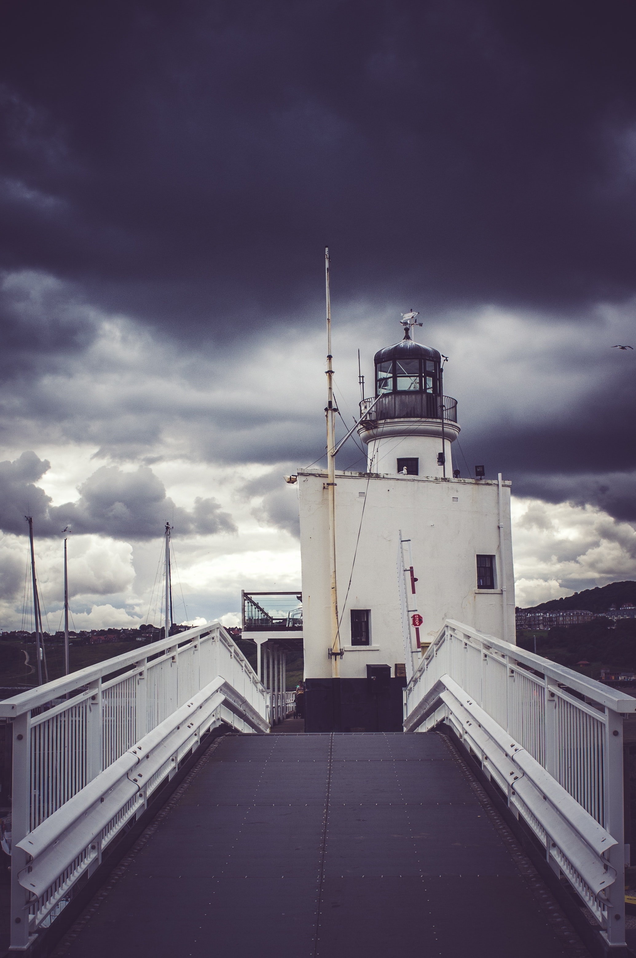 View of cloudy skies on lighthouse photo