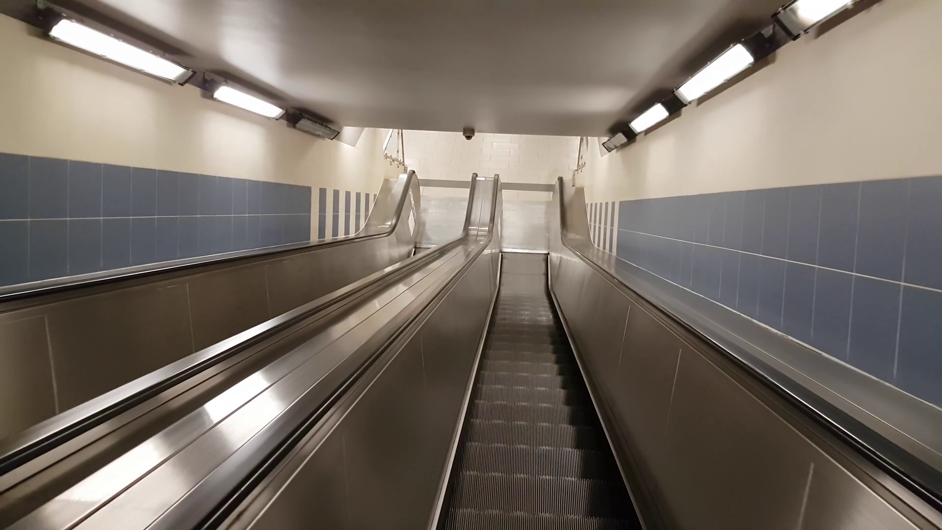 POV view moving down by escalator Stock Video Footage - Videoblocks
