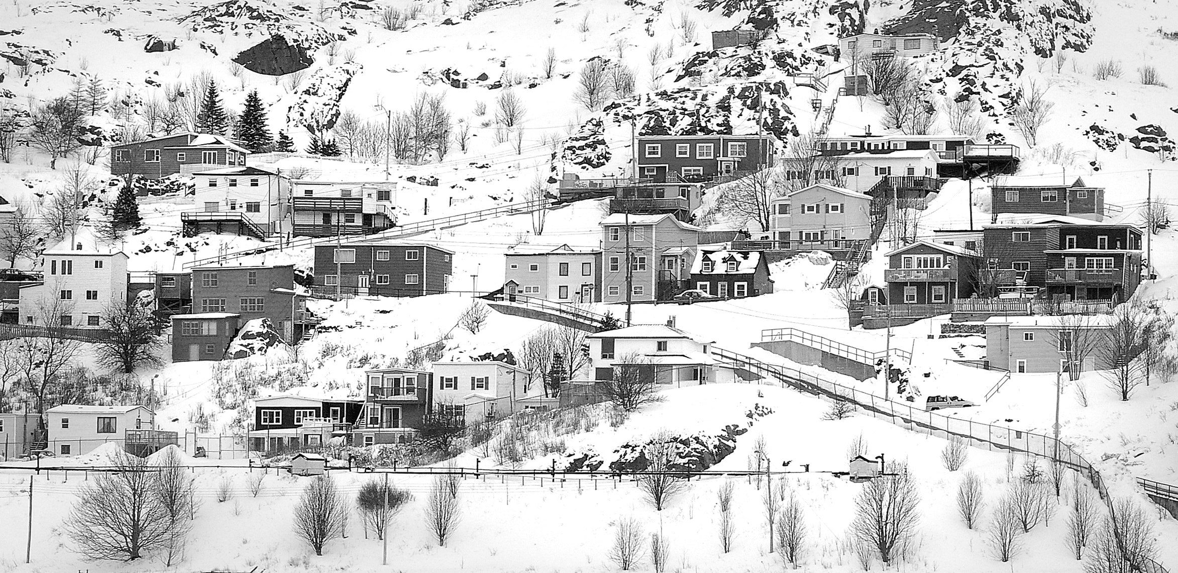 Village on mountain covered with snows photo