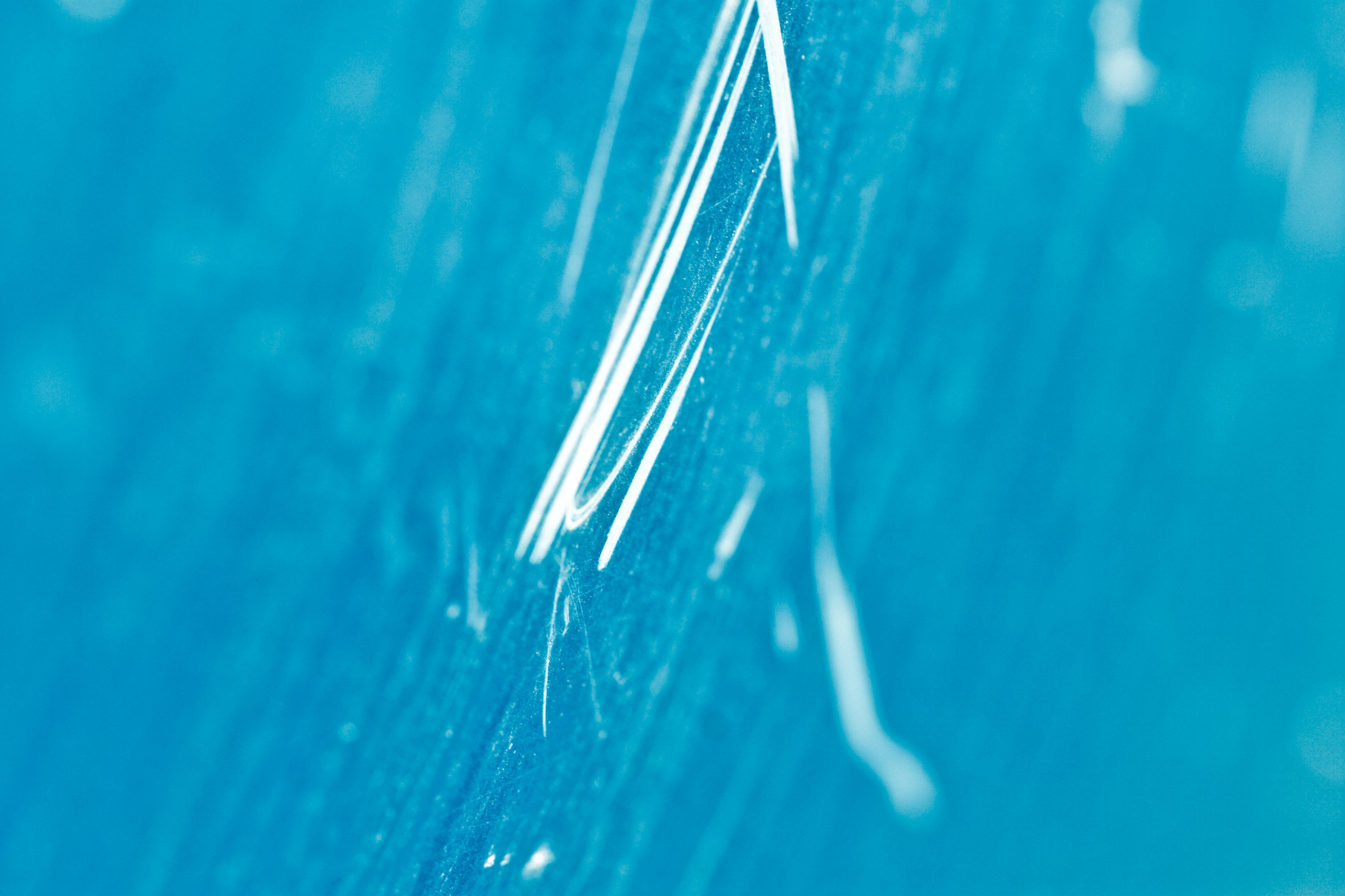 Vivid blue scratched metal texture photo