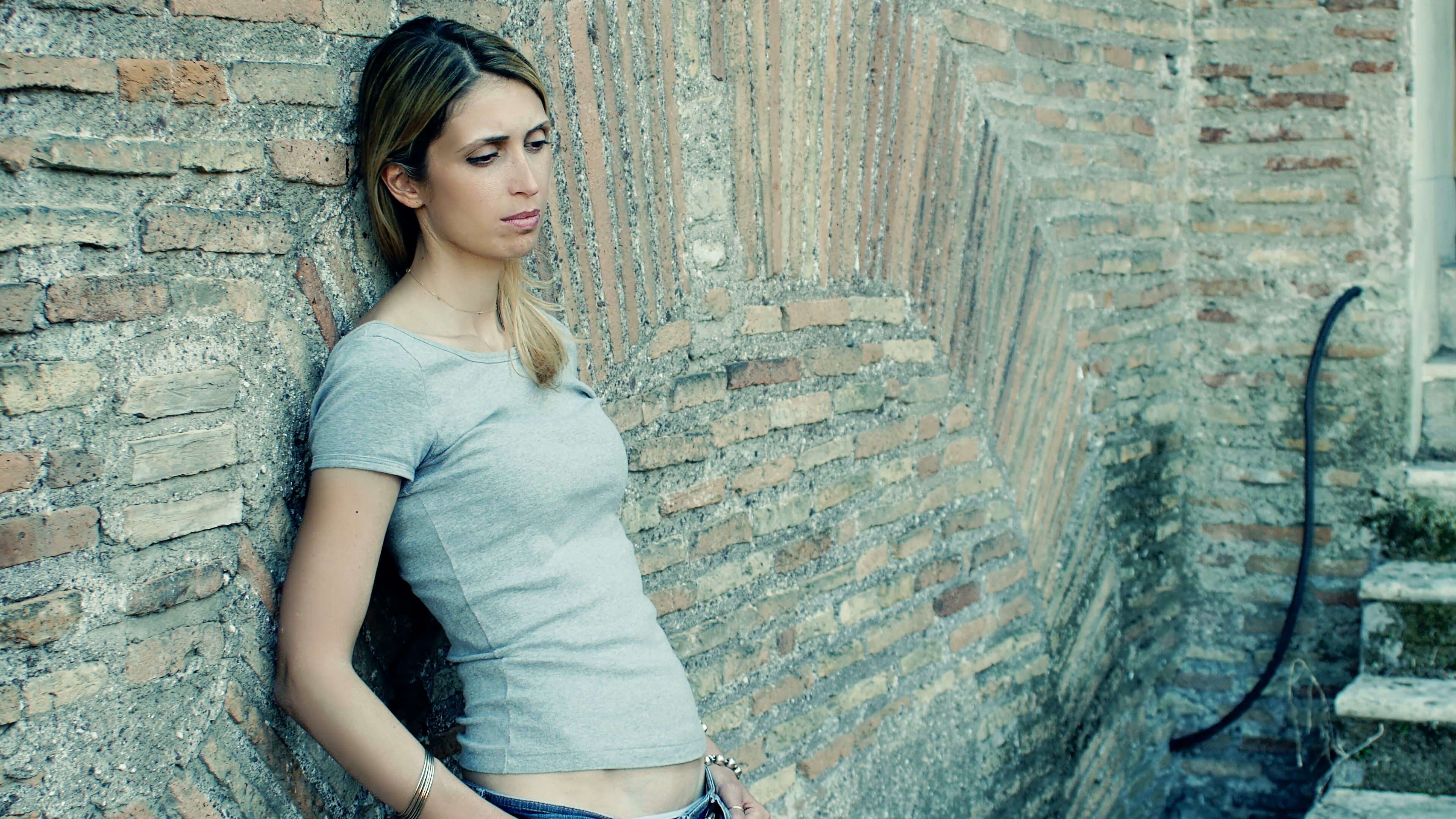girl sad and pensive leaning against the wall: loneliness, anxiety ...