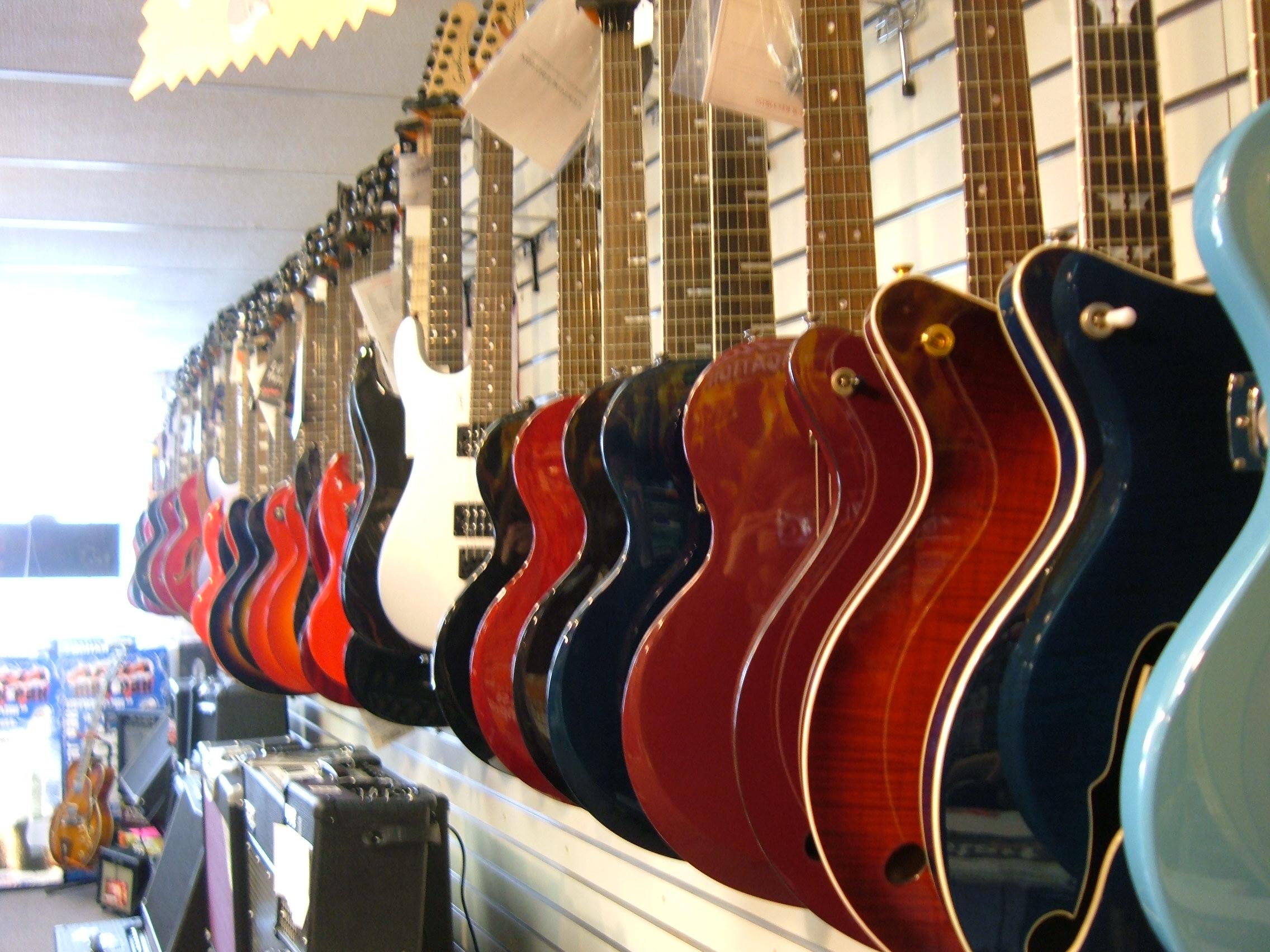 wall of guitars on Grinnell Gallery