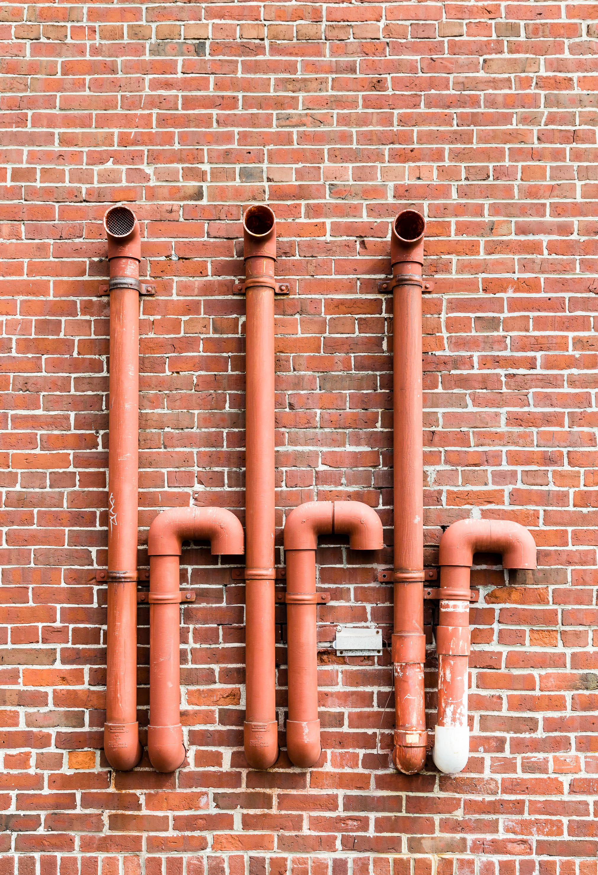 Red Pipes on Red Brick | darrylbrooks